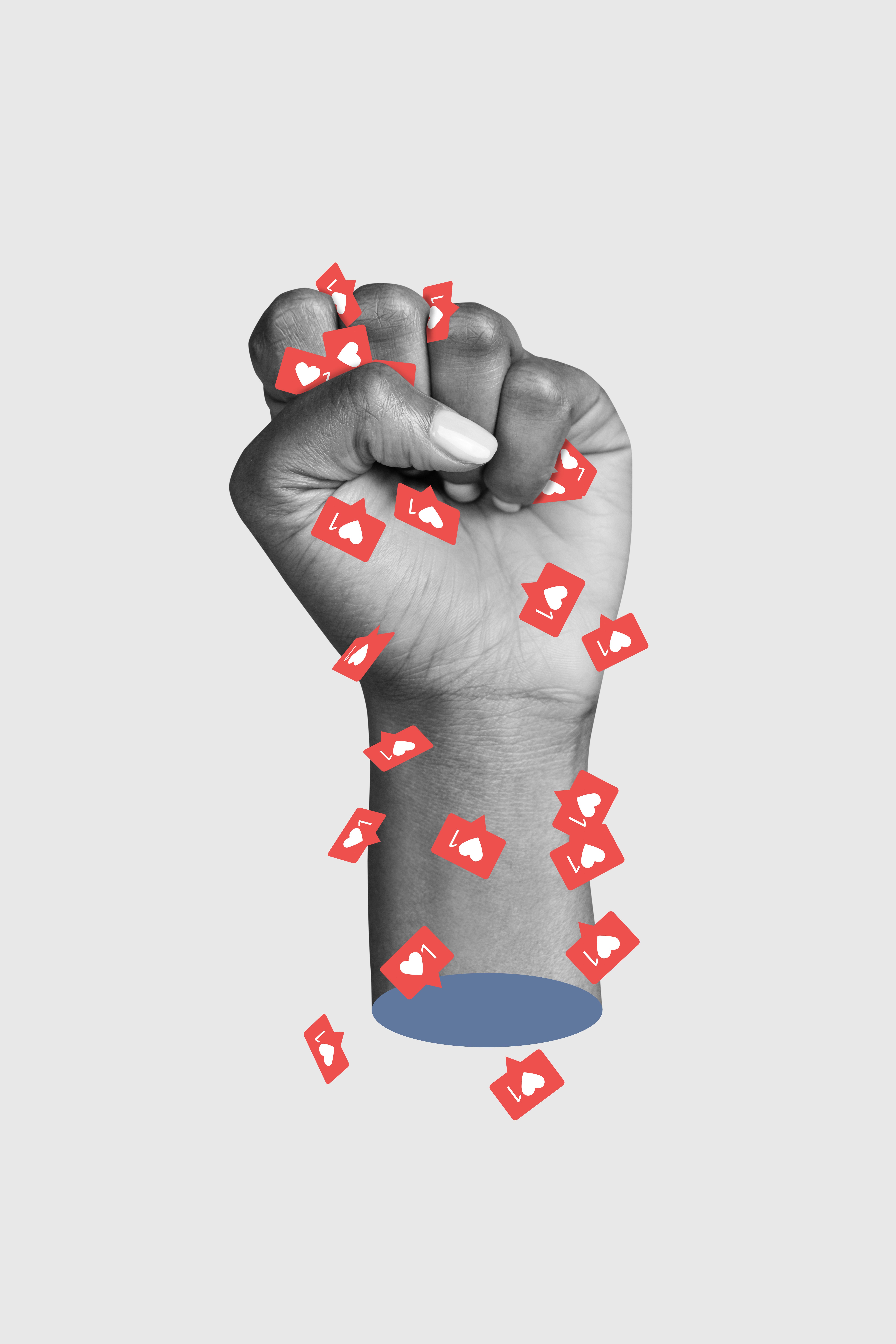 Raised fist wrapped in a swarm of heart reaction icons
