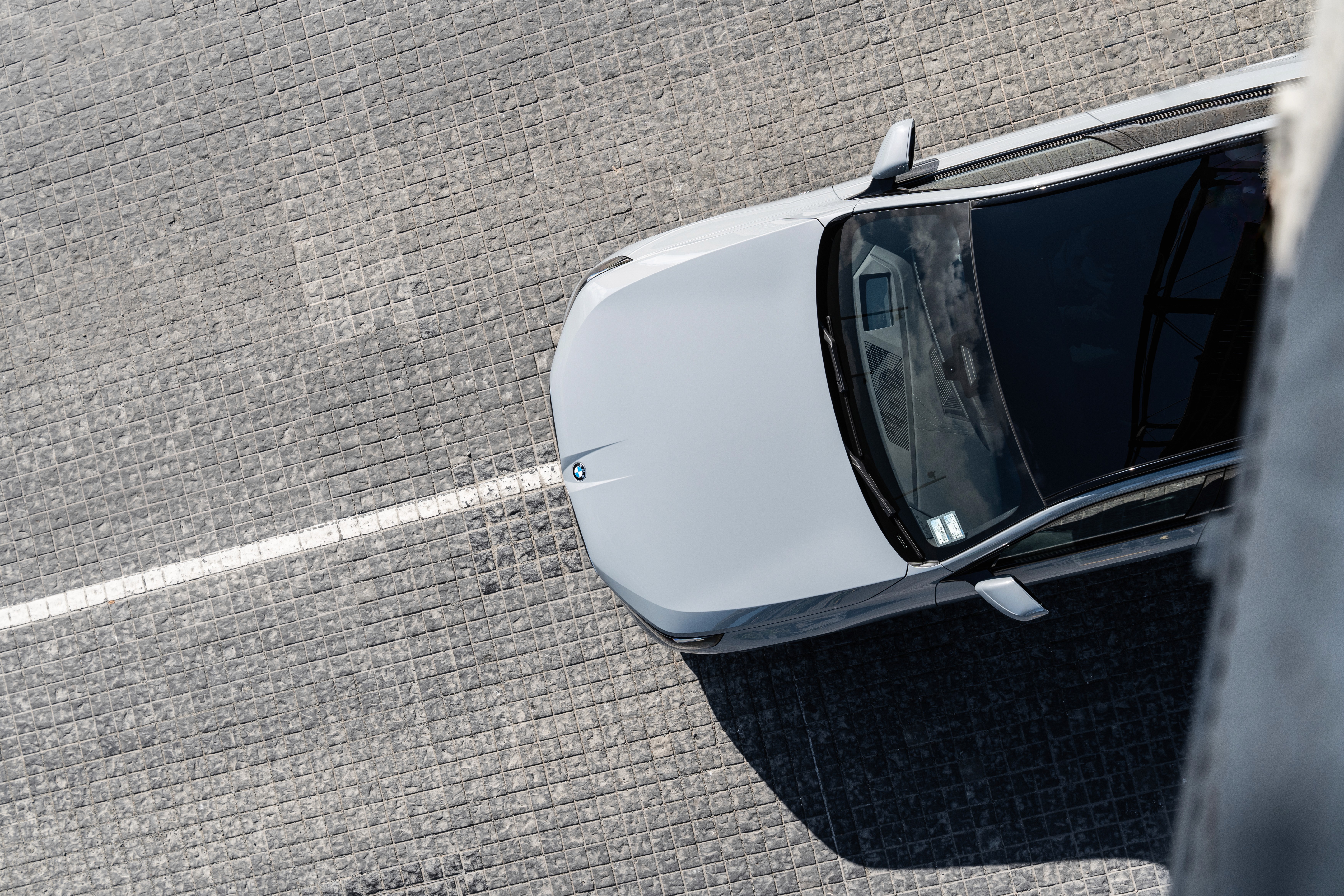 Streetside billboard with flyposters of the Batch.Works brand and illustrations