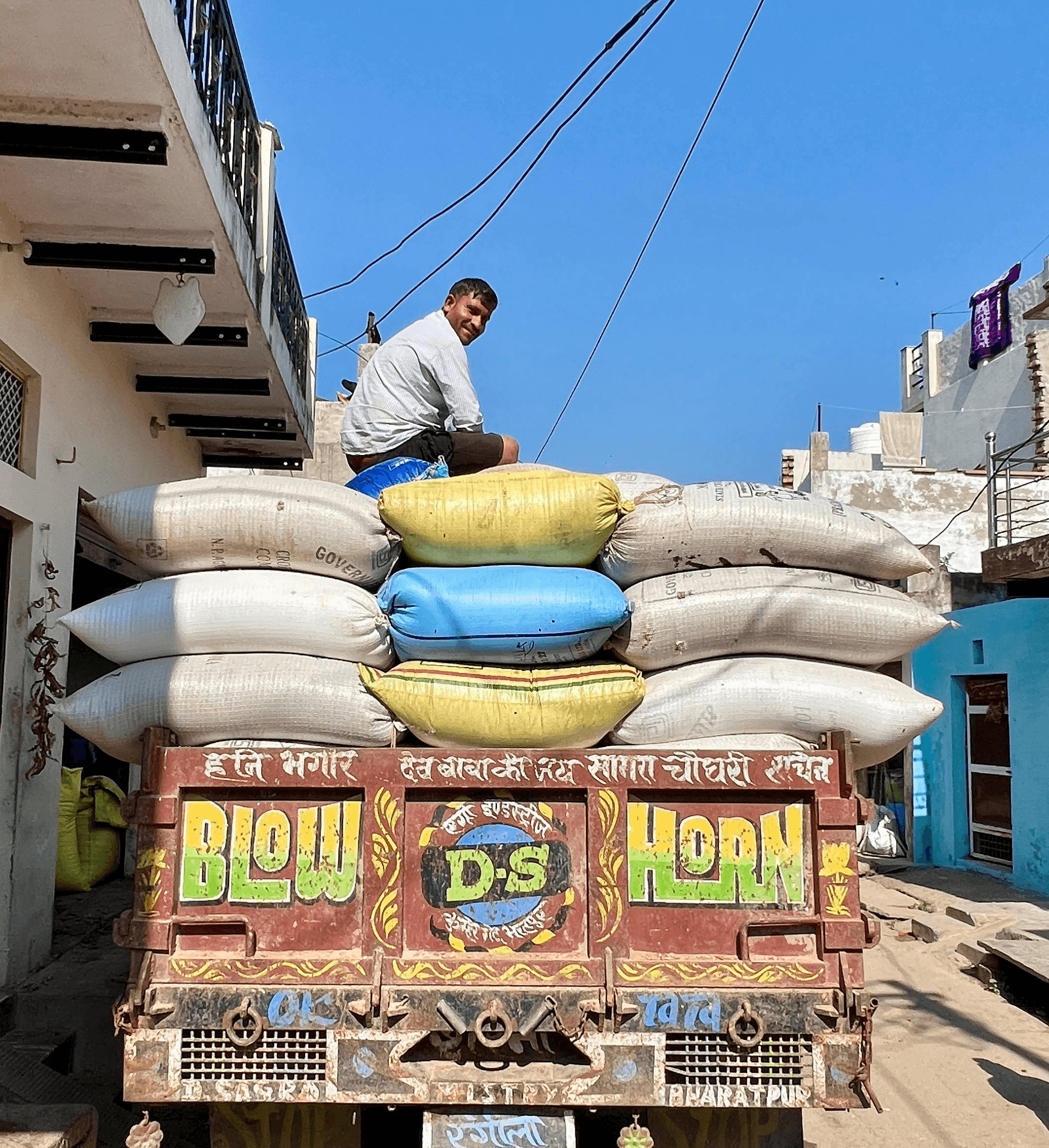 man and woman sitting on concrete bench during daytime