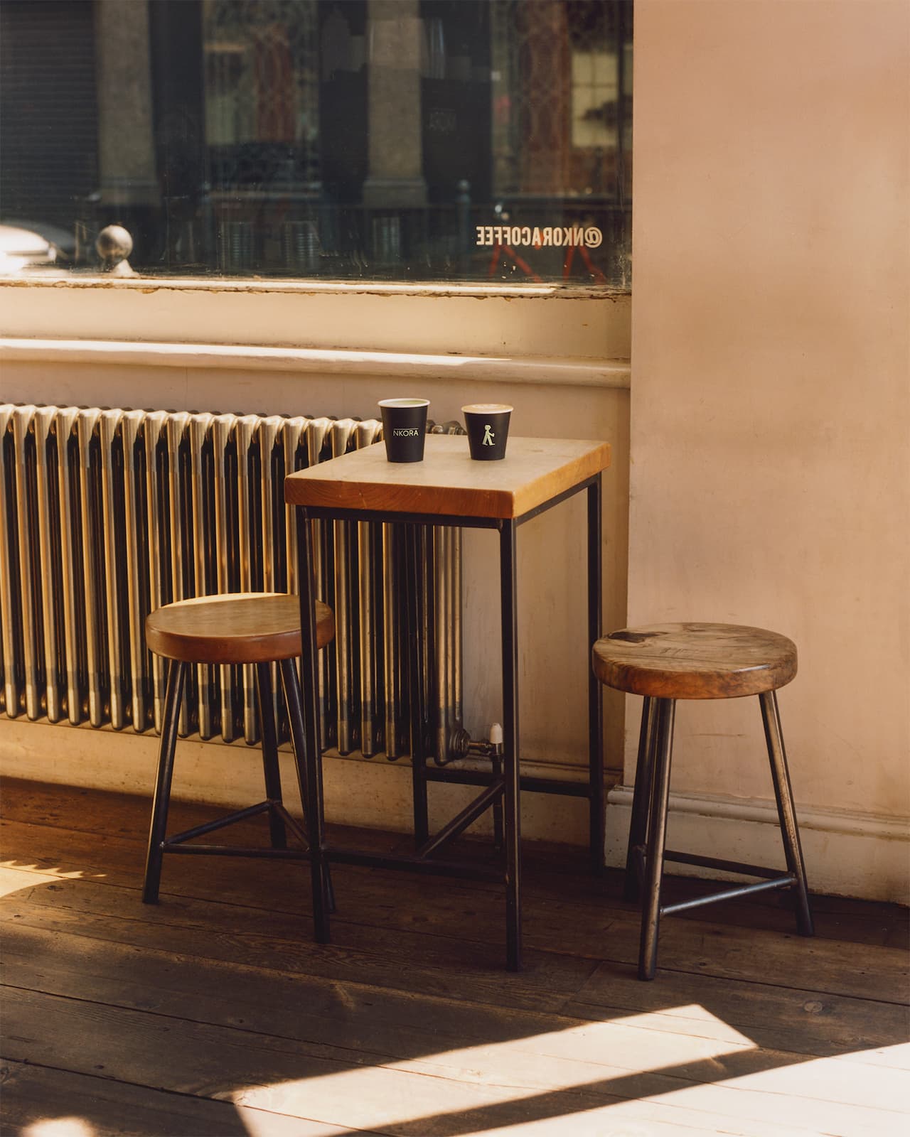 Coffee Cups and Interior Seatings inside NKORA Cambridge Heath Coffee Shop