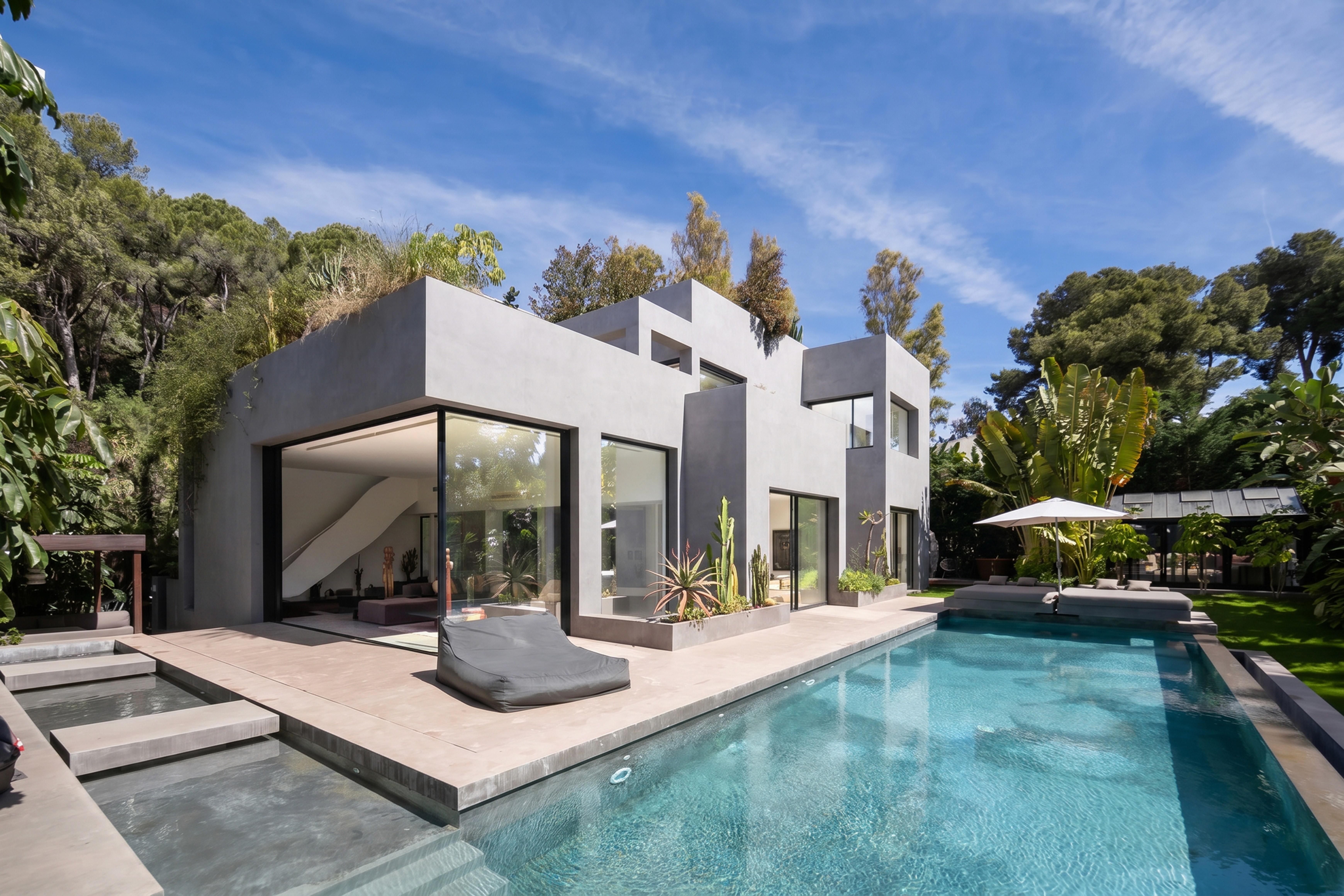 Pool and outdoor living area at Soul House, luxury villa in Los Monteros Marbella by Ghara