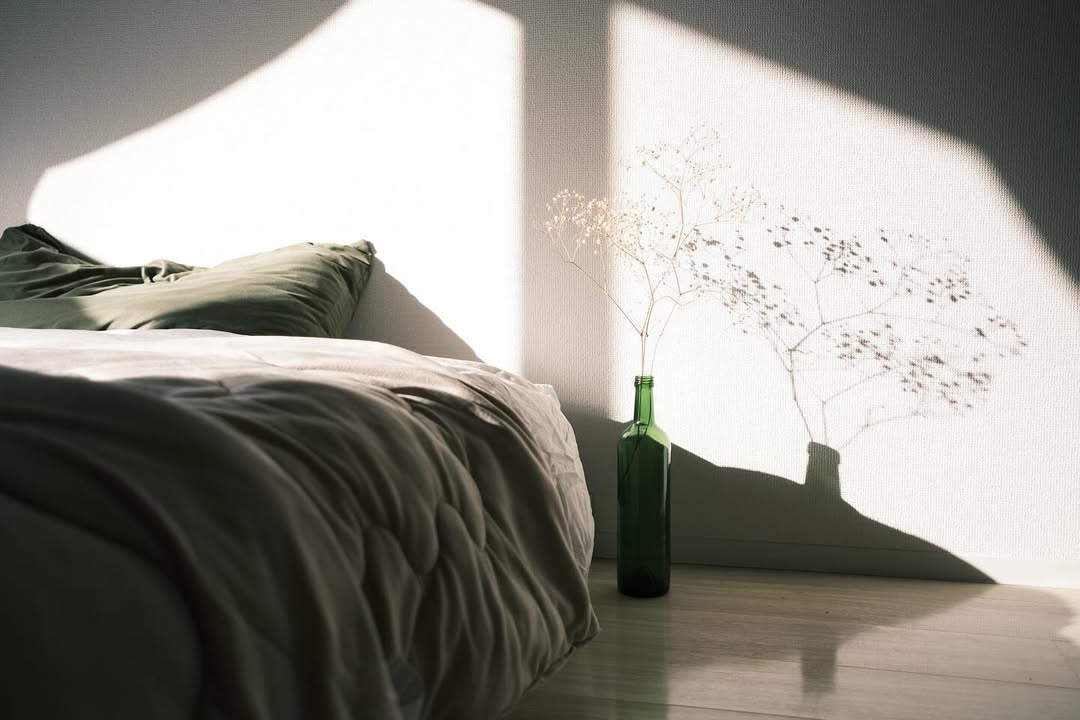 The image captures the ethereal beauty of an underwater cave illuminated by sunbeams penetrating through an opening above.