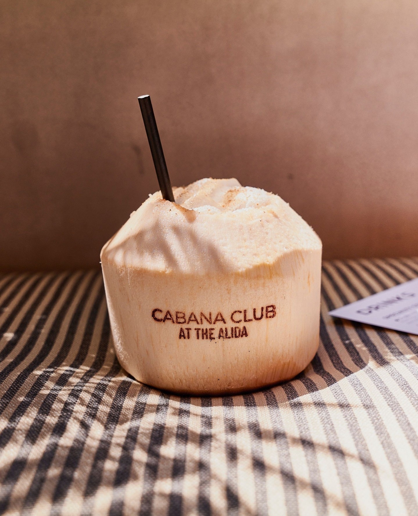 Chilled coconut with Cabana Club logo at Alida Hotel, Savannah, Georgia.