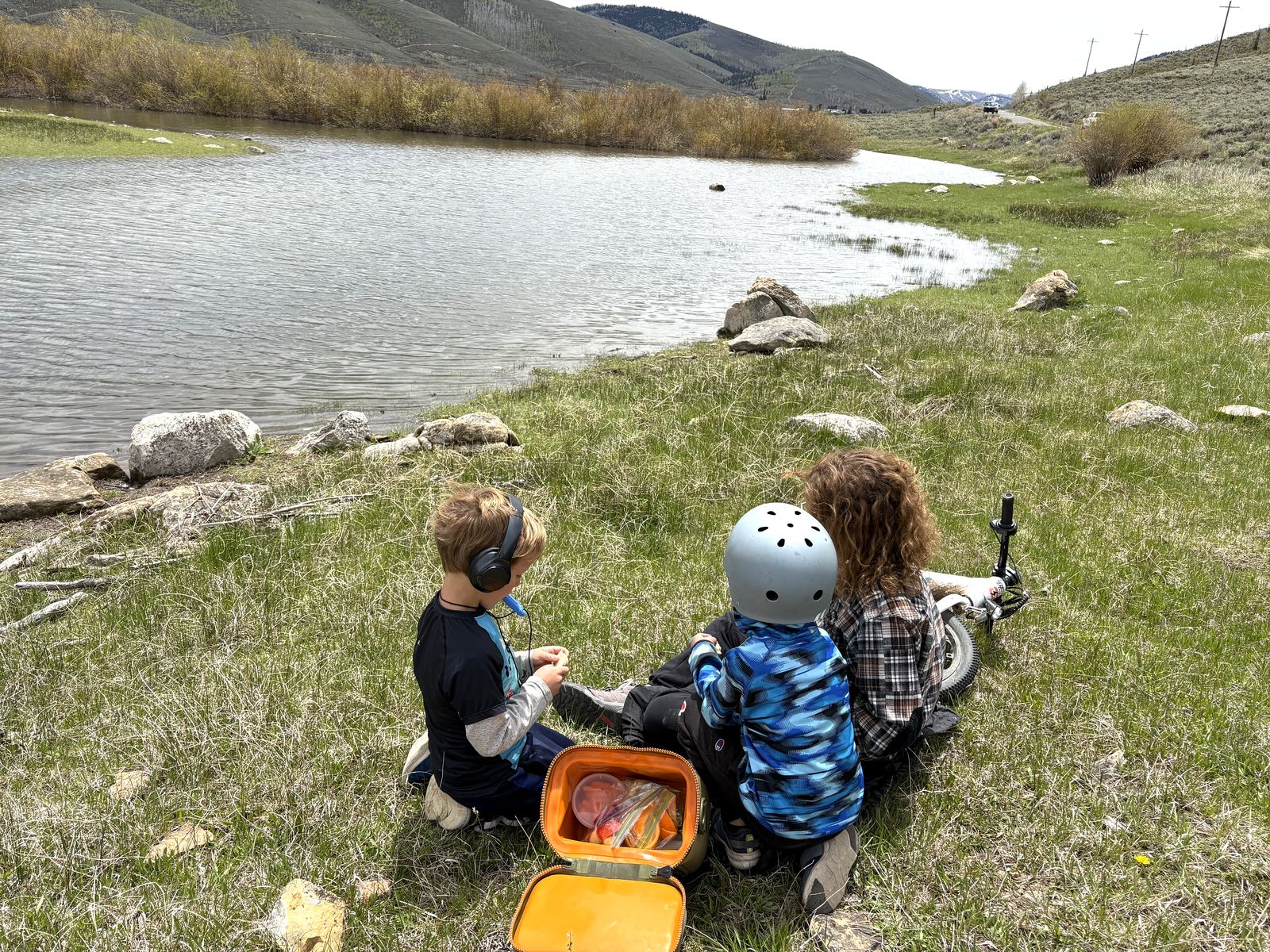 The kids taking a snack break along the shoreline of Scofield Reservoir