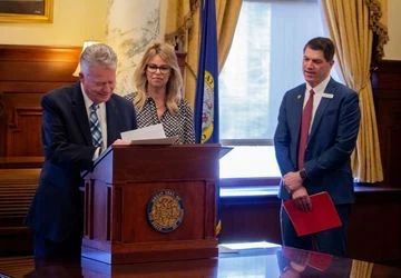 Gov. Brad Little signing SB 1227, guidance for AI in schools, with Superintendant for Public Instruction Debbie Critchfield and Sen. Kevin Cook, R-Idaho Falls on March 26, 2026 (Joel Hroma for CBS2)