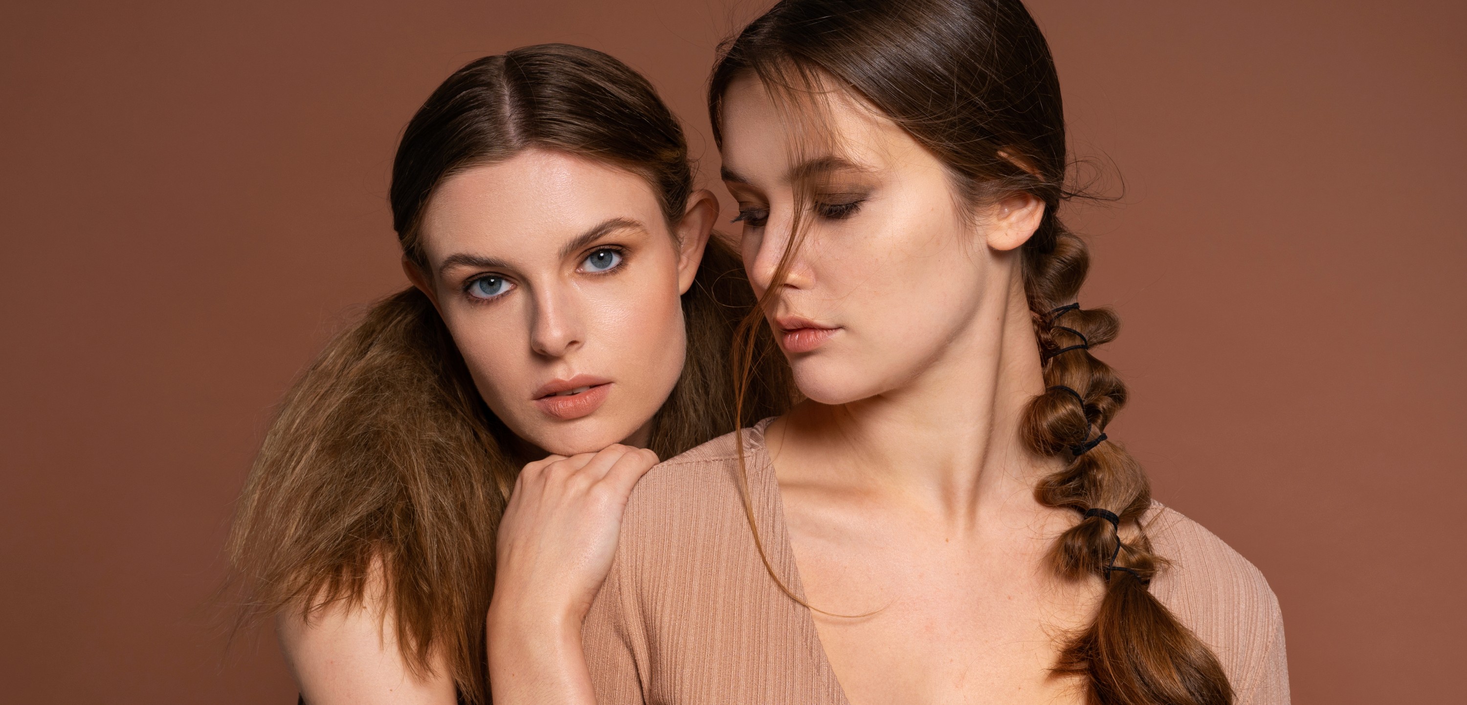 two young women with hairstyle and natural makeup