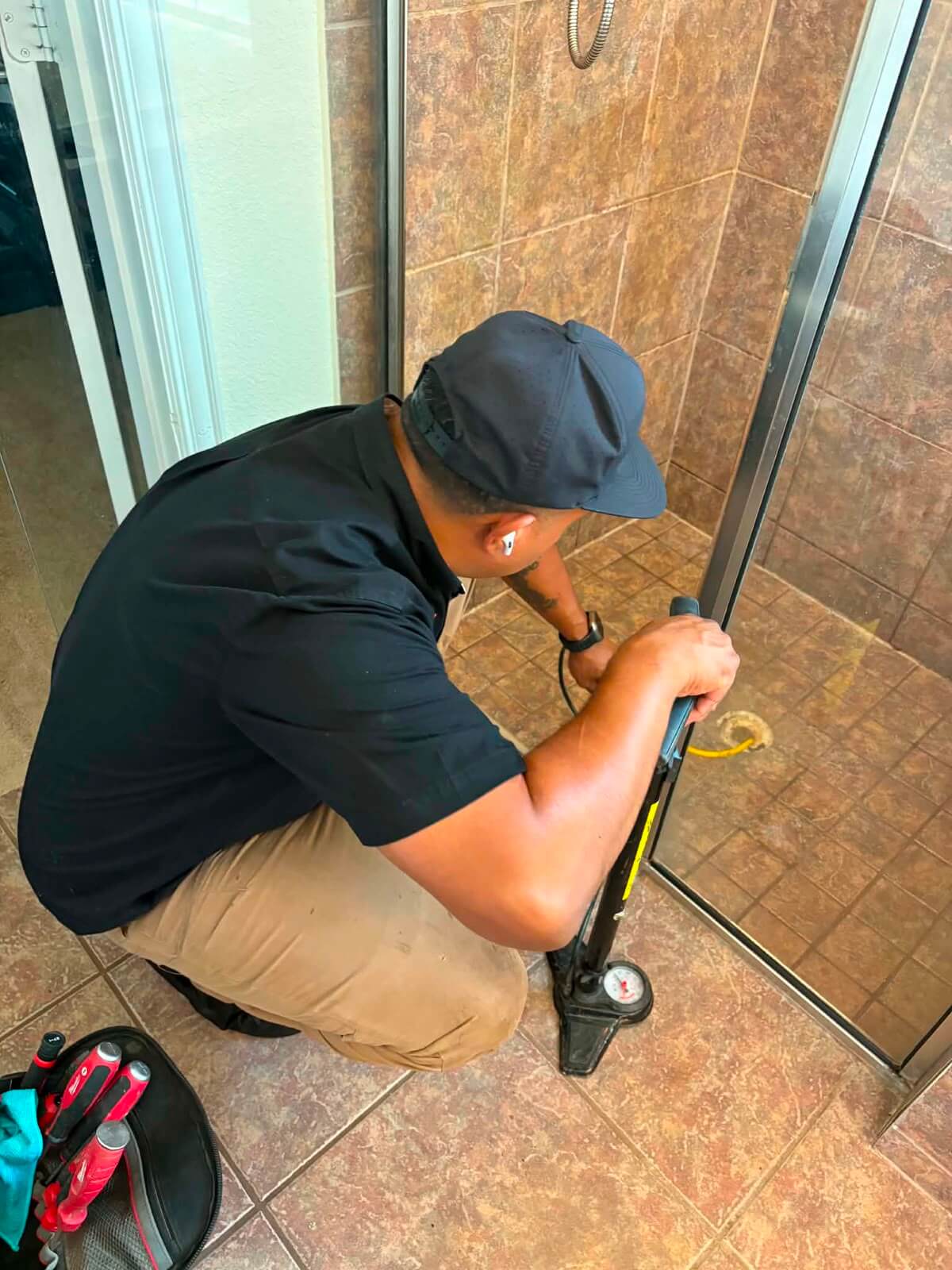 Performing shower pan water test in Arlington, Texas