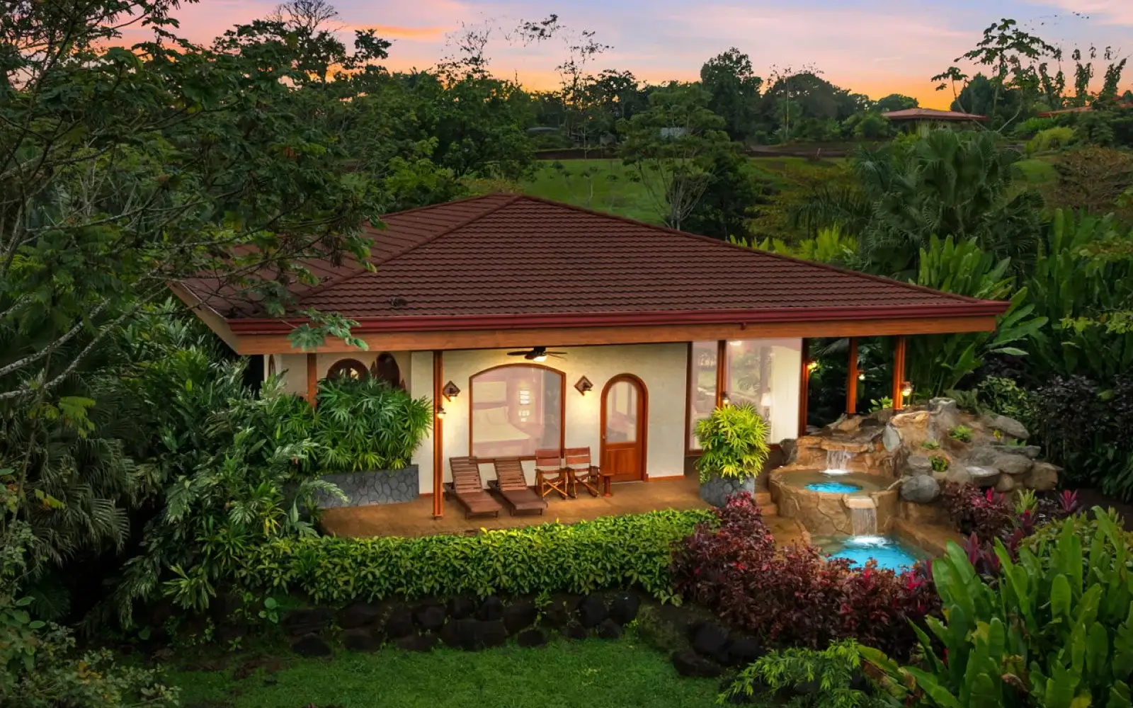 Villa Ramírez at Arenal Hills with the sun setting