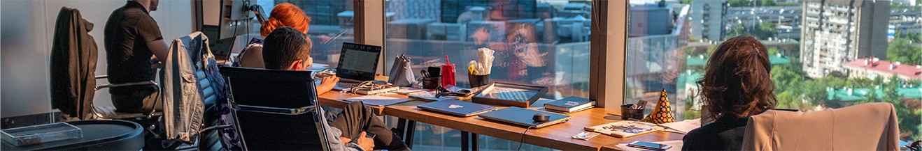 Office Workers By The Window