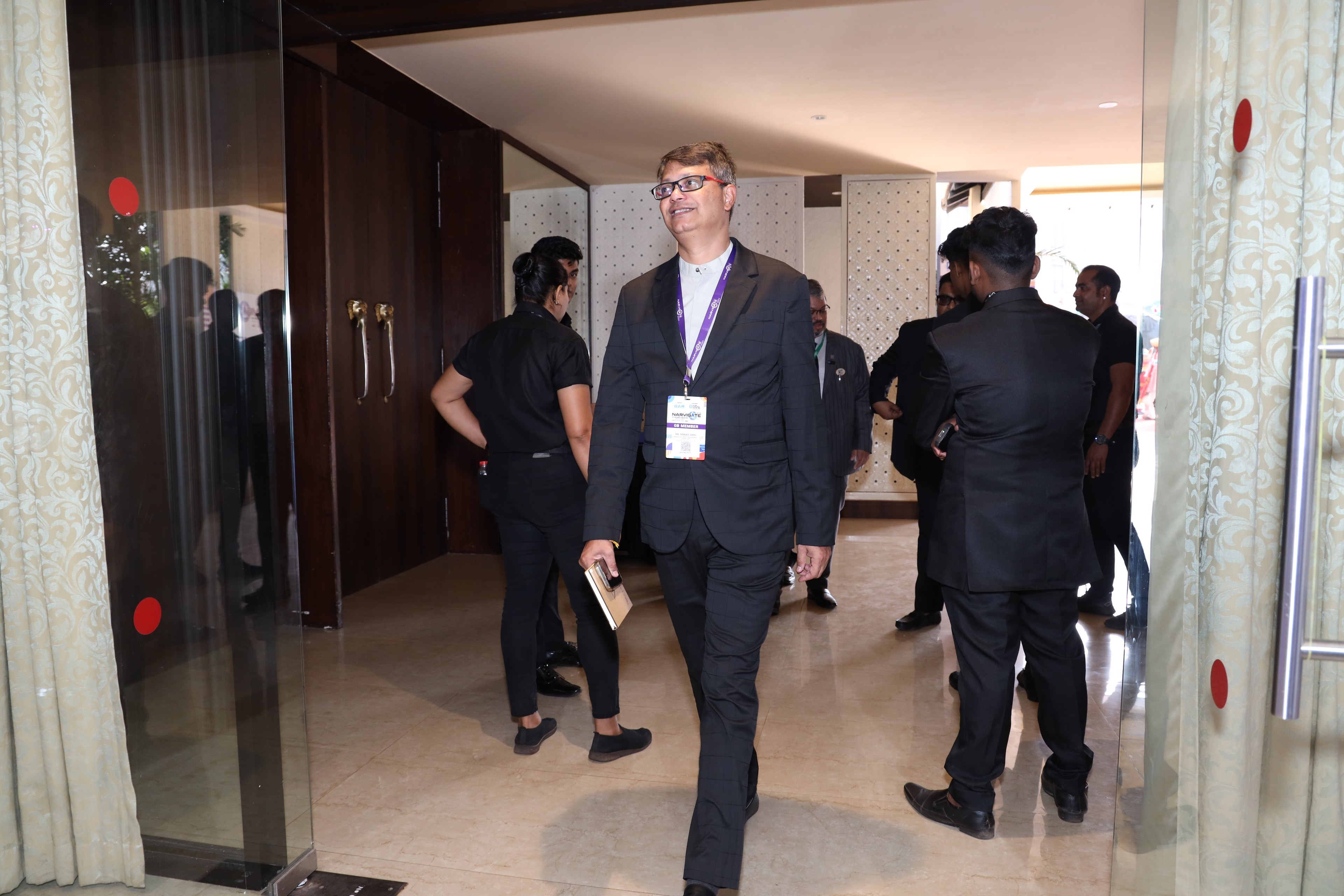 a group of tall buildings under a cloudy blue sky