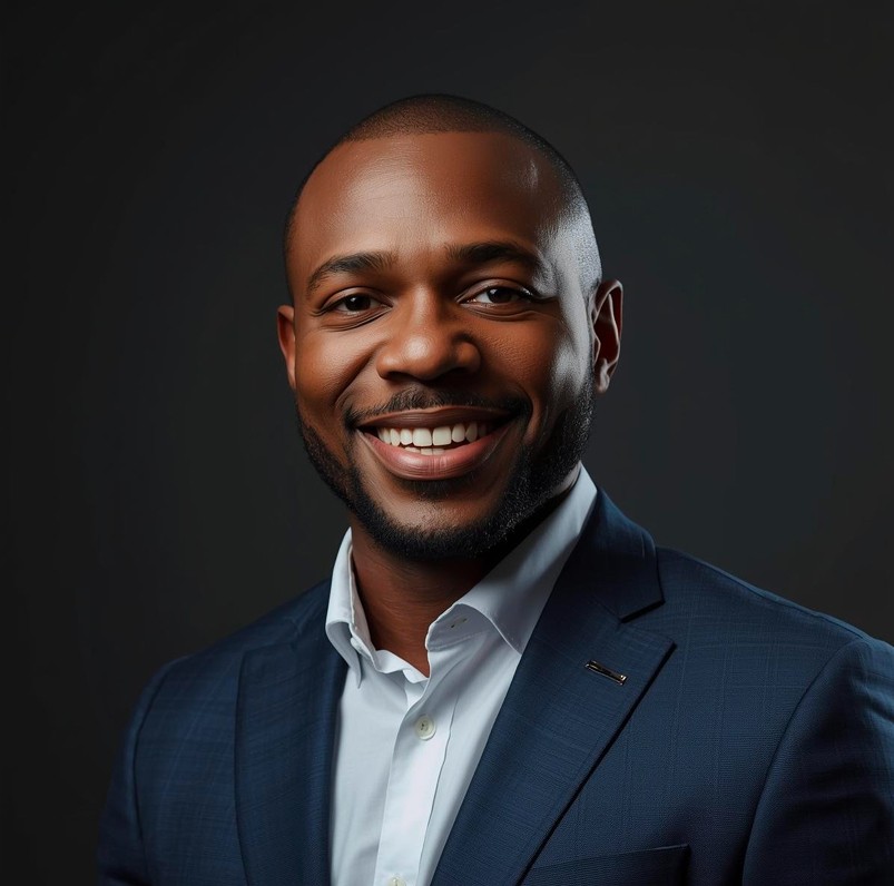 Dark man wearing suit.