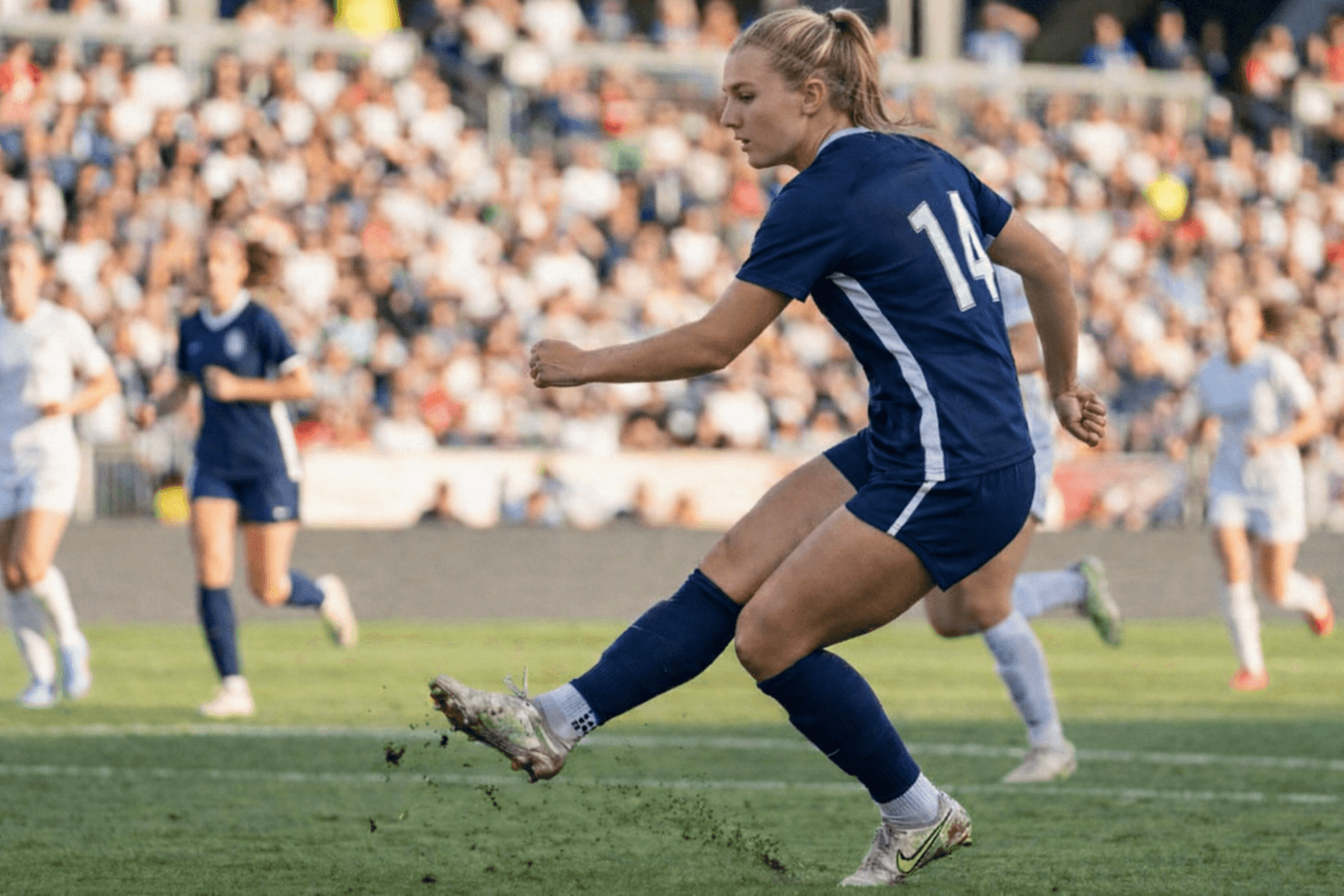 Soccer player kicking ball