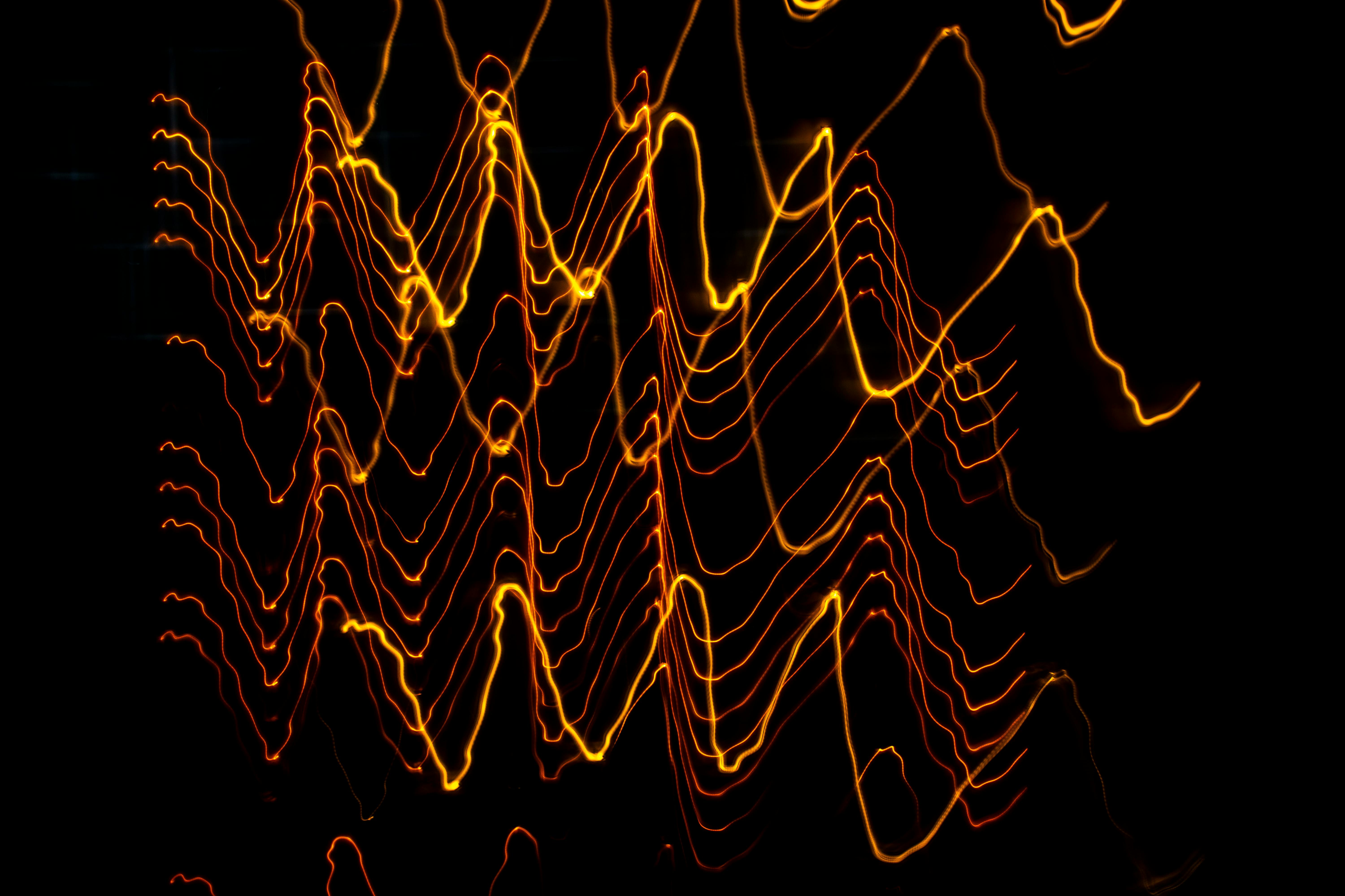 Abstract signal waveforms on a black background