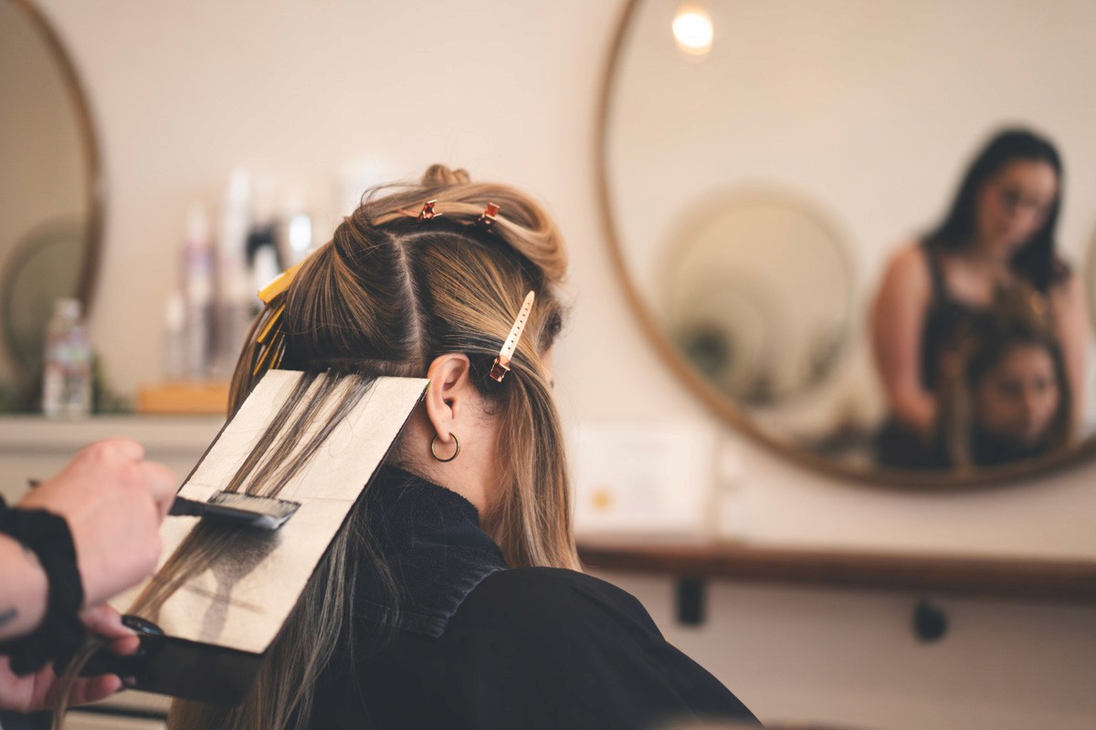 Modern blonding service in progress at Del Sol Hair Studio, Huntington Beach