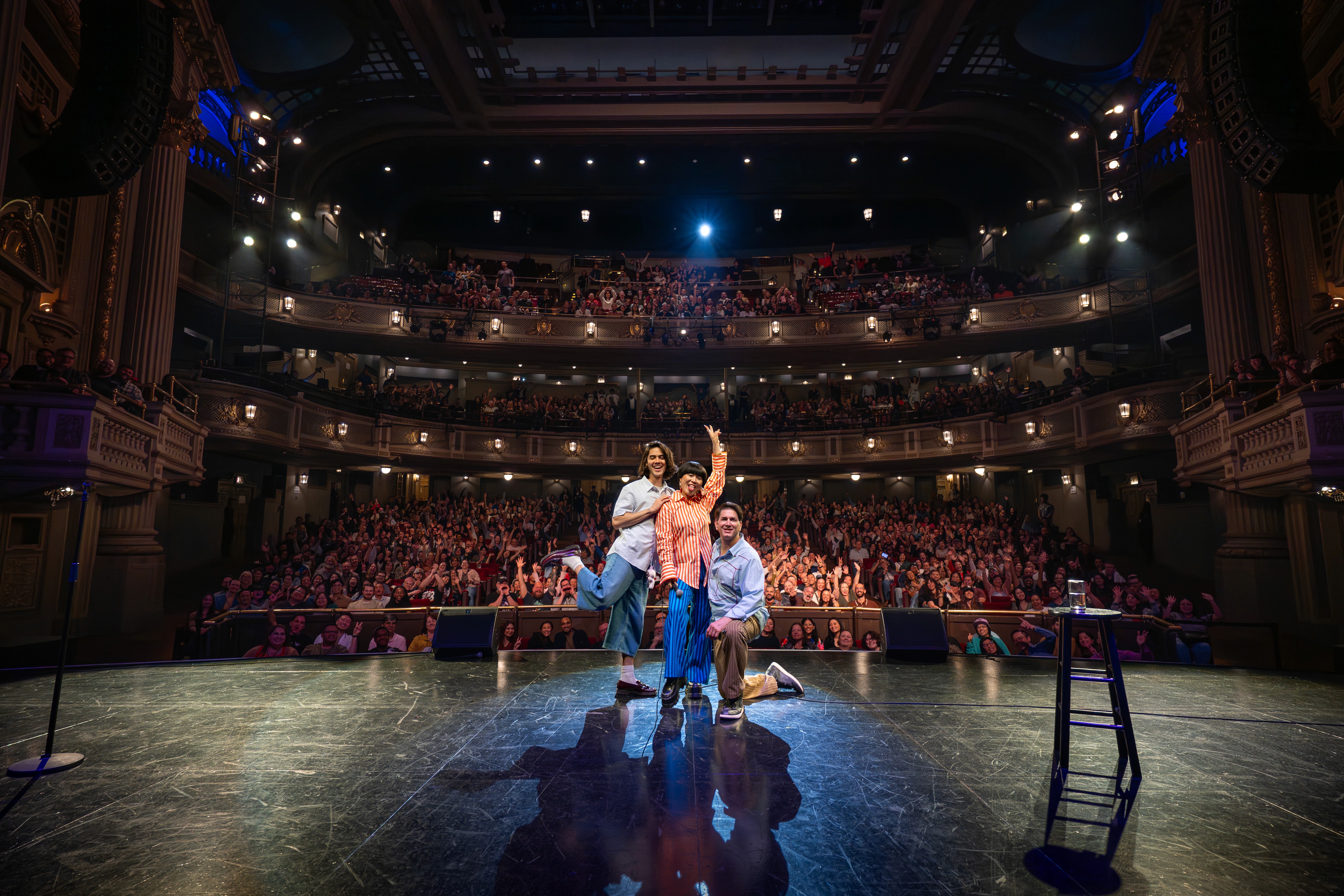 Exterior of The Pavilion at Toyota Music Factory with a green Toyota RAV4 parked out front, surrounded by summer greenery.
