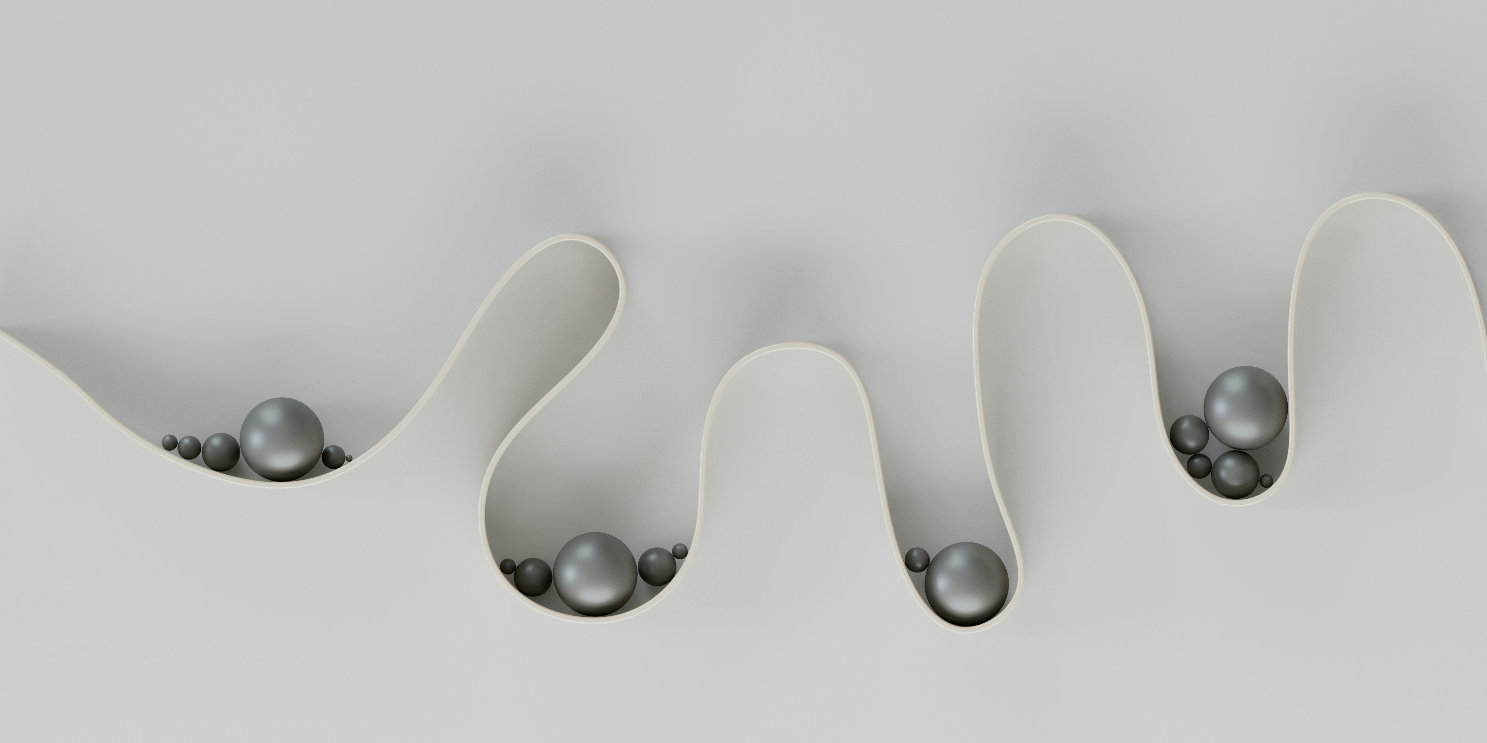 Abstrakt illustrasjon av en bølgende form med kuler som symboliserer kontroll og flyt.