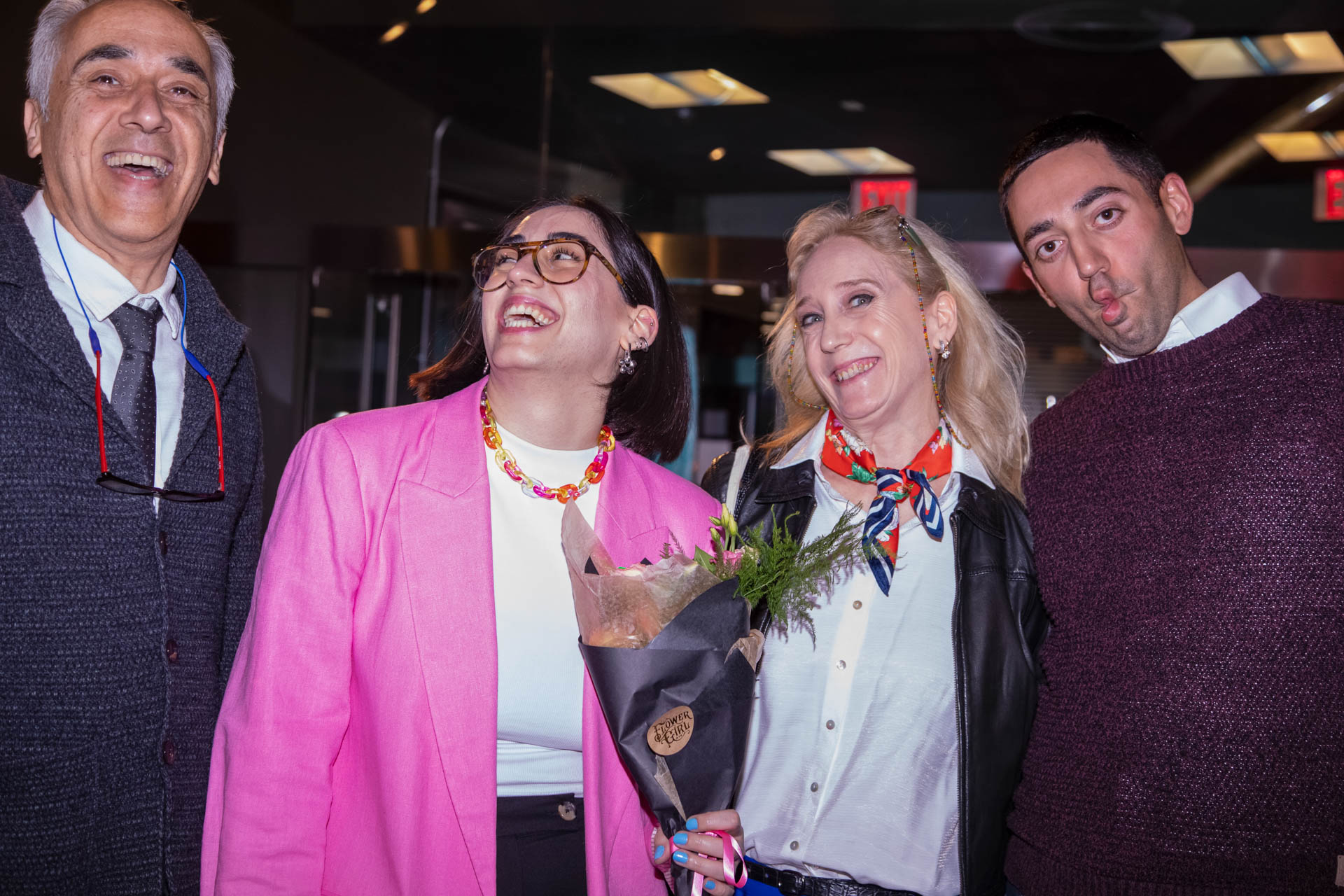 a group of students smiling for the camera in the SVA Theatre lobby after the Venture Forum