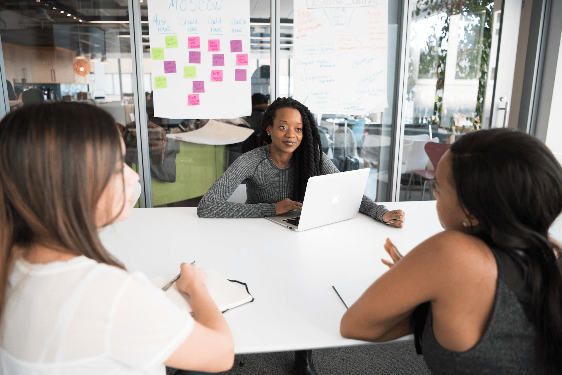 A diverse group of people discussing how to foster a winning team culture