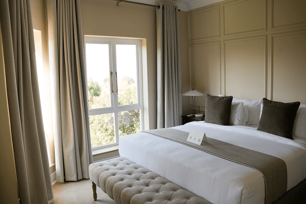 Private lounge area in Premier Room with comfortable seating and work space.