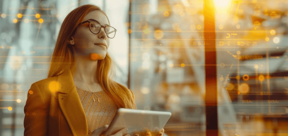 A focused young professional with a confident expression stands holding a digital tablet, surrounded by a futuristic interface of glowing orange data streams, symbolizing technology and innovation.
