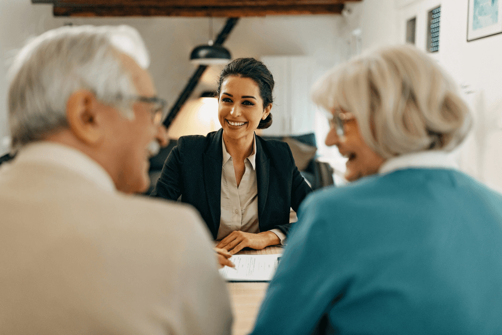 senior couple consults with female financial advisor