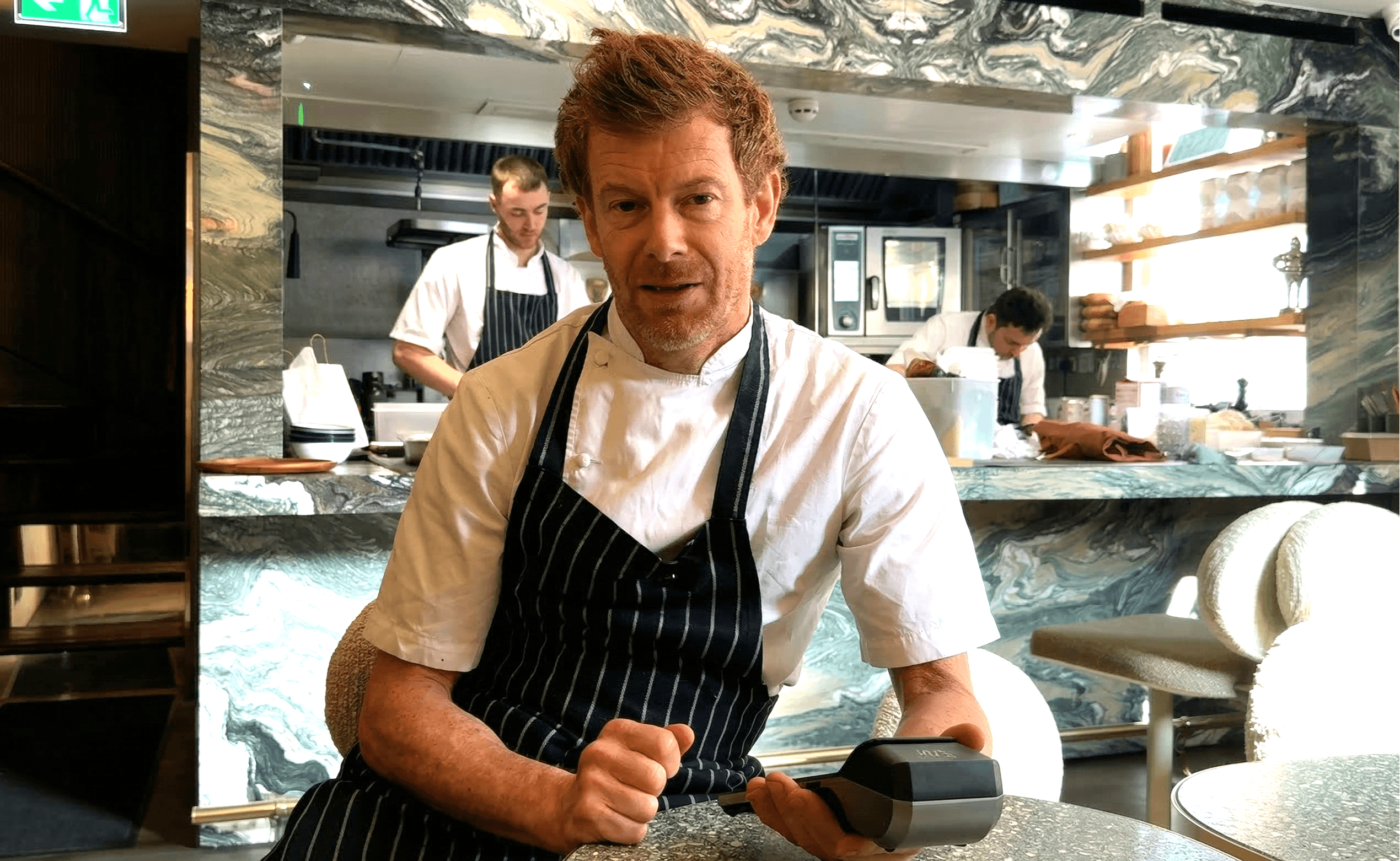 Tom Aikens holding a Labl.it device in Muse