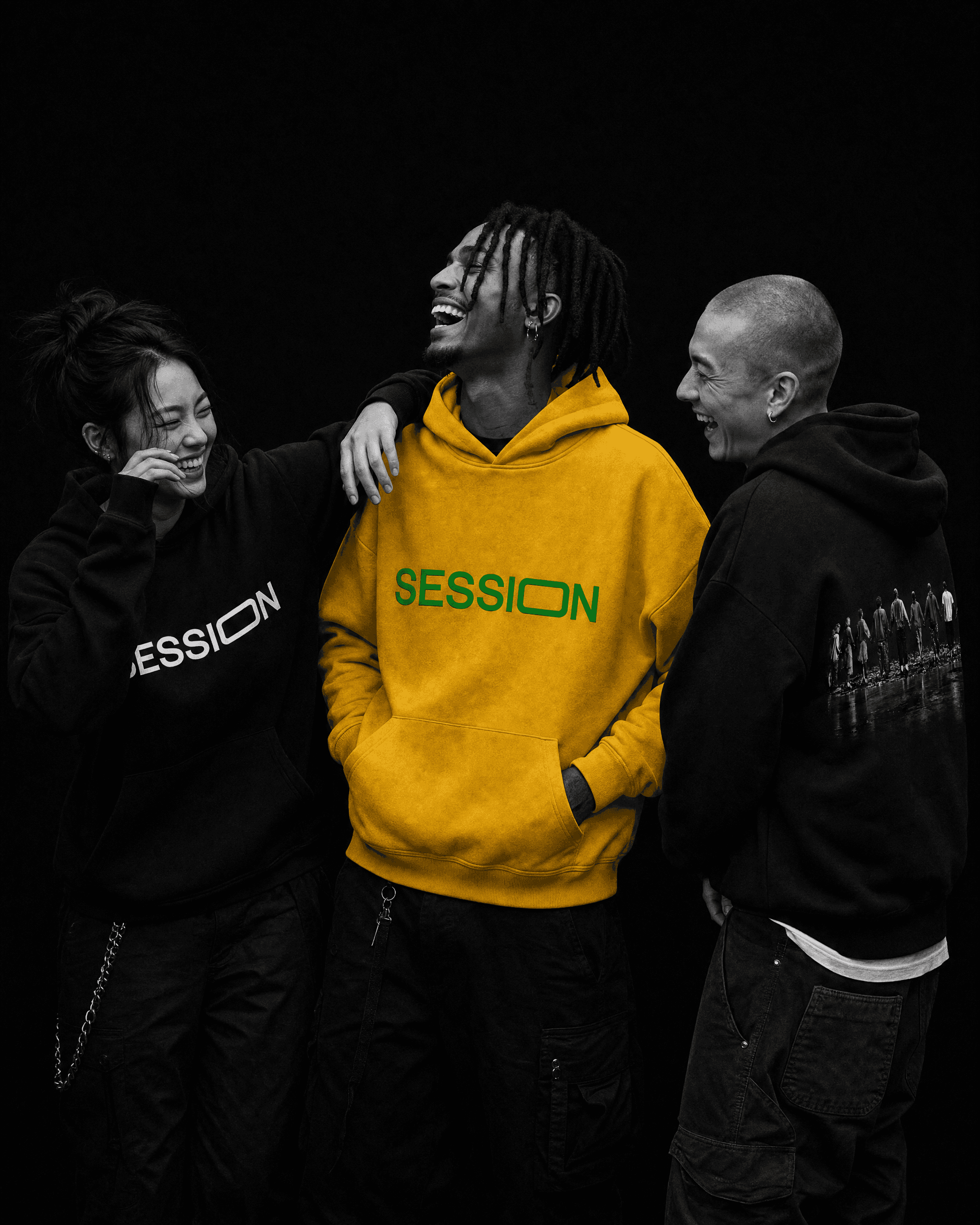 Three friends laughing together, with a yellow Session Zone logo hoodie between two black hoodies.