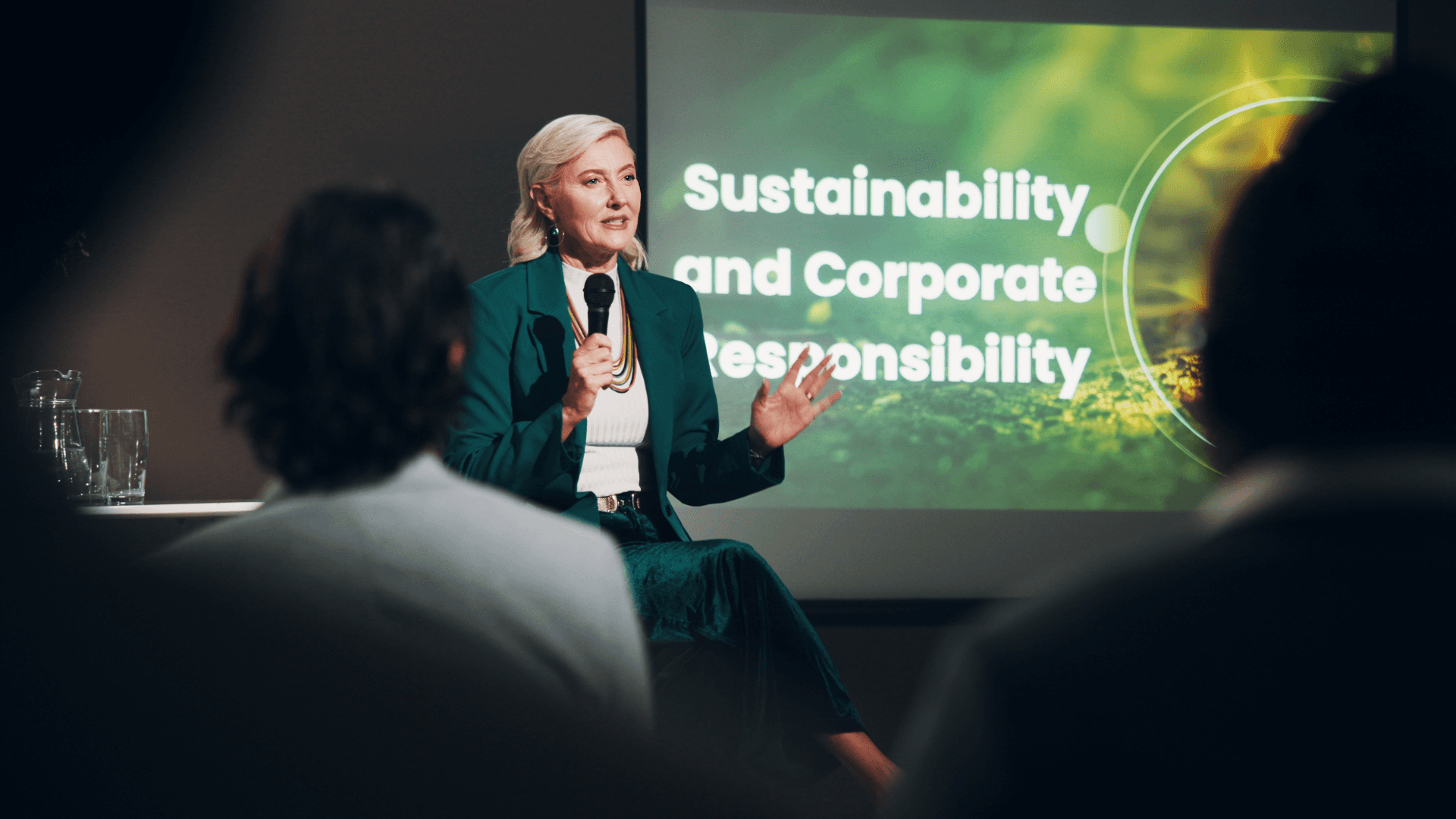 Sustainability leader presenting on corporate responsibility and ESG strategy, highlighting the skills gap in net zero leadership within facilities management.
