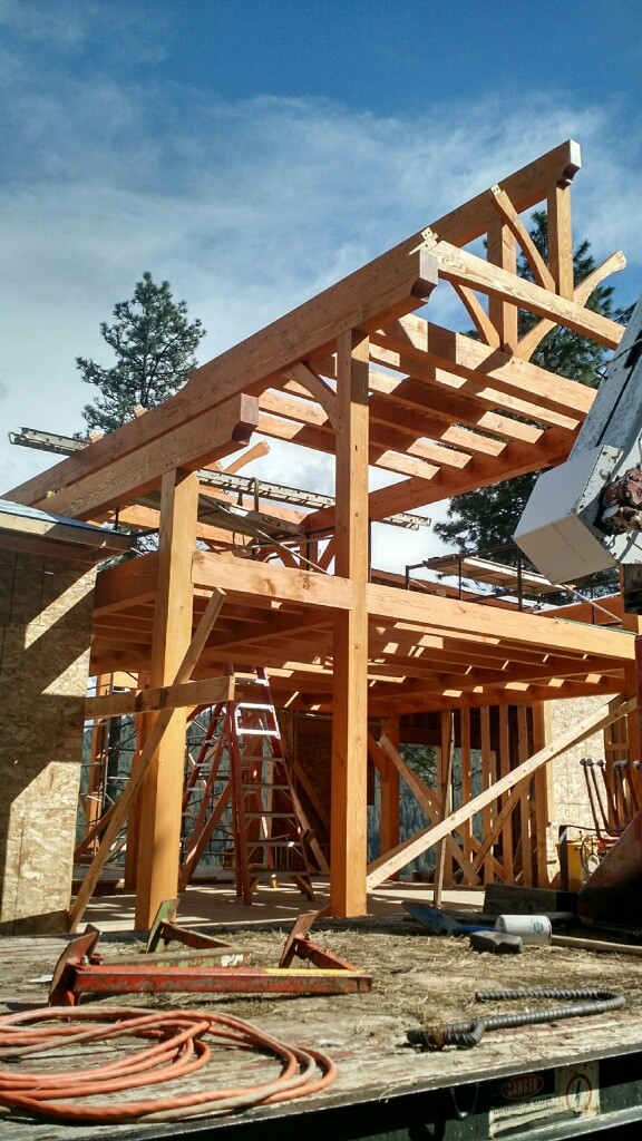 Interior of a warm, modern café rendered in line-art style with high ceilings, pendant lighting, and wood and metal furnishings.