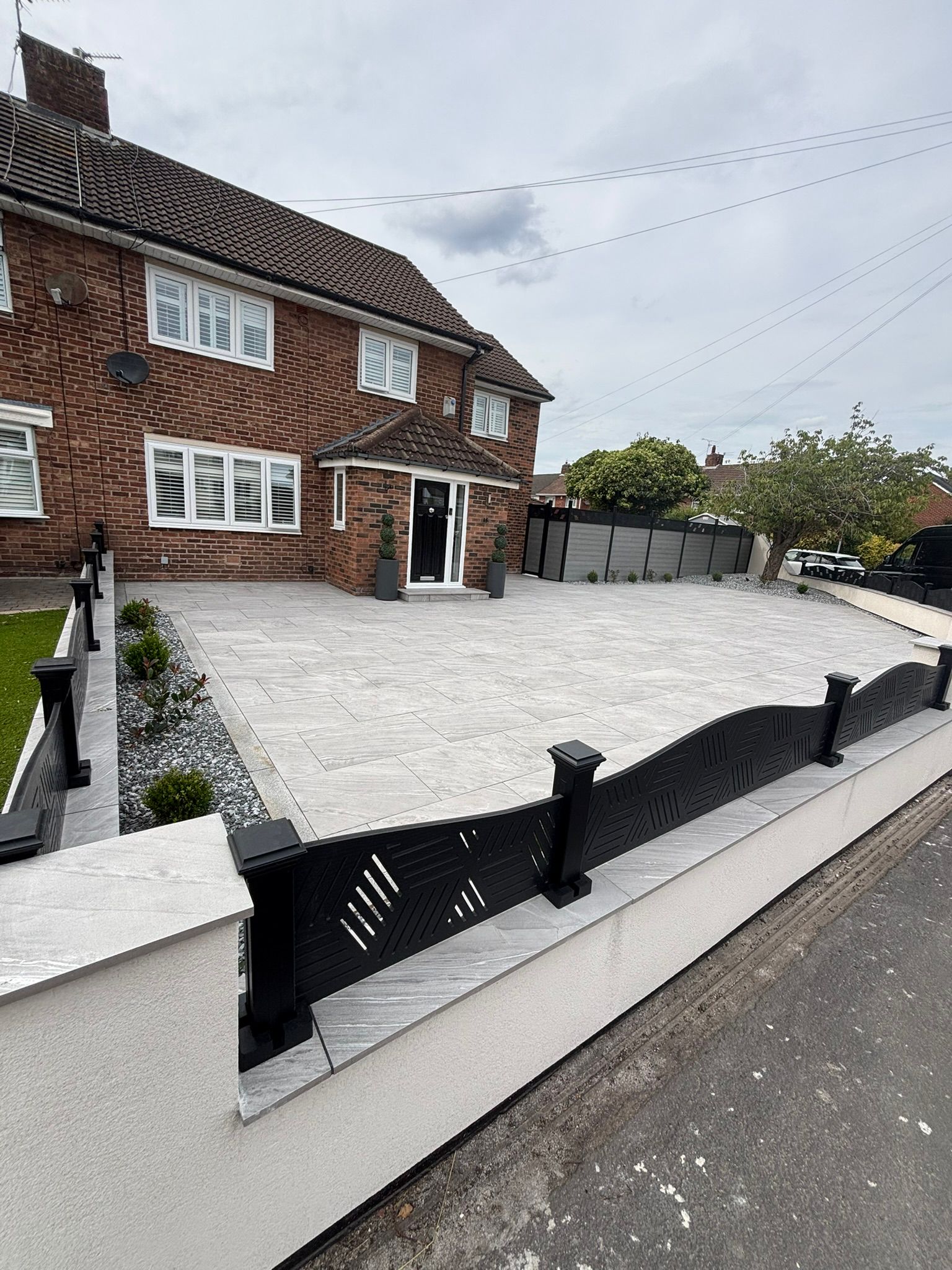 Completed Aintree front and rear landscaping transformation with porcelain paving and contemporary finishes