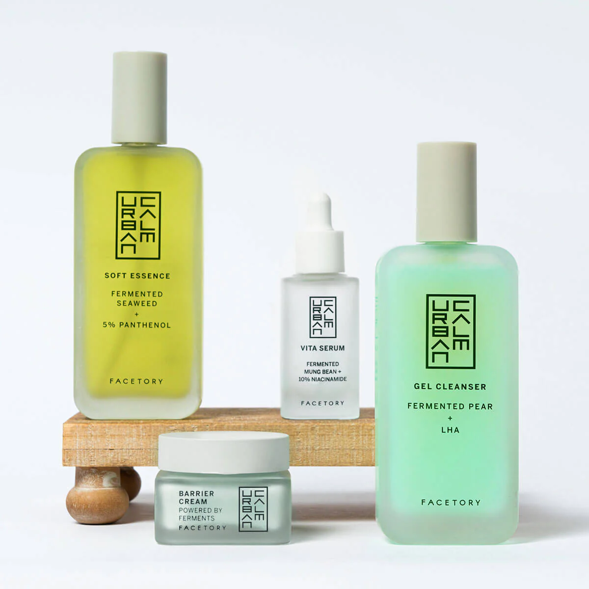 Streetside billboard with flyposters of the Batch.Works brand and illustrations