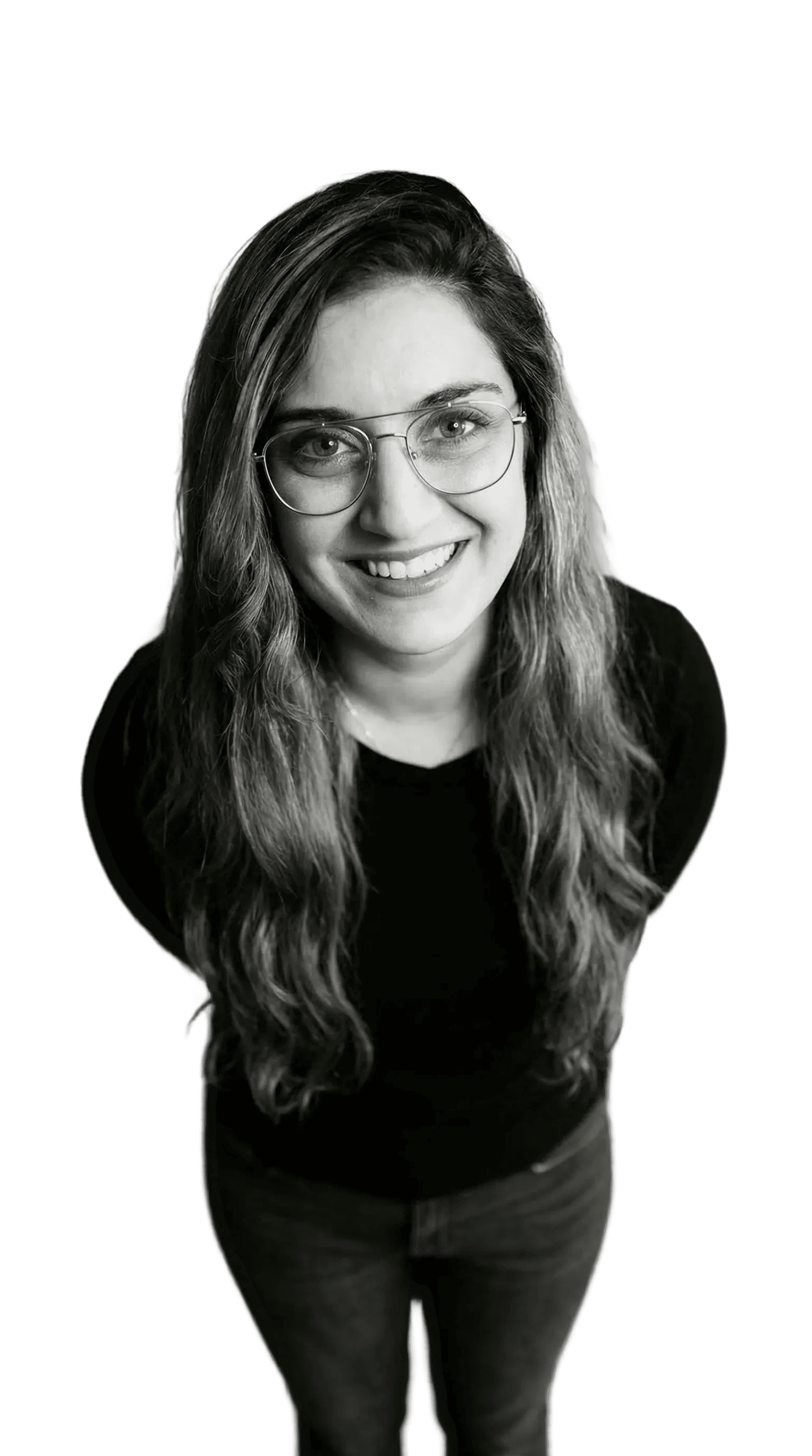 Professional woman in a suit standing in an office setting.
