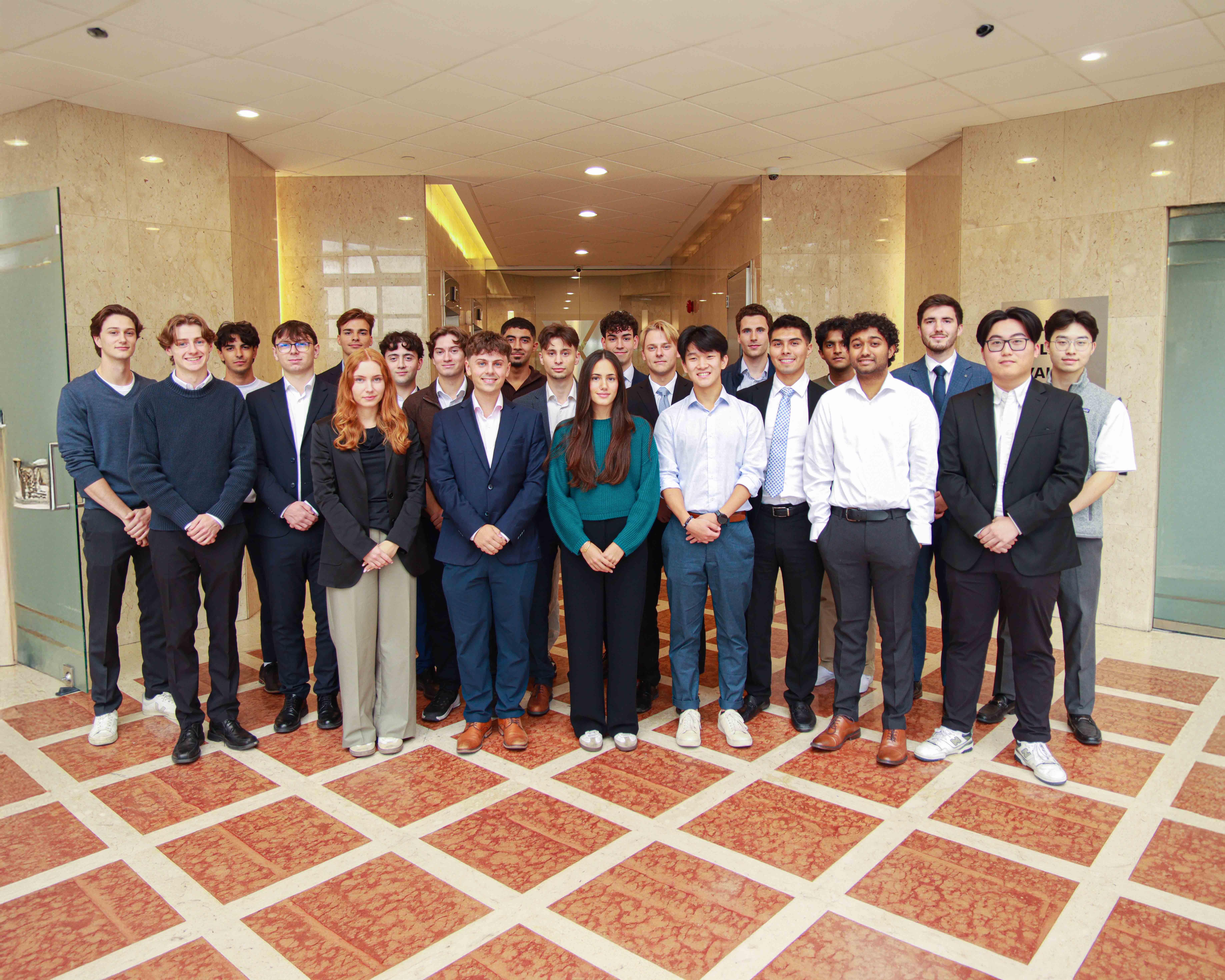 A young man looking toward the horizon in an office.