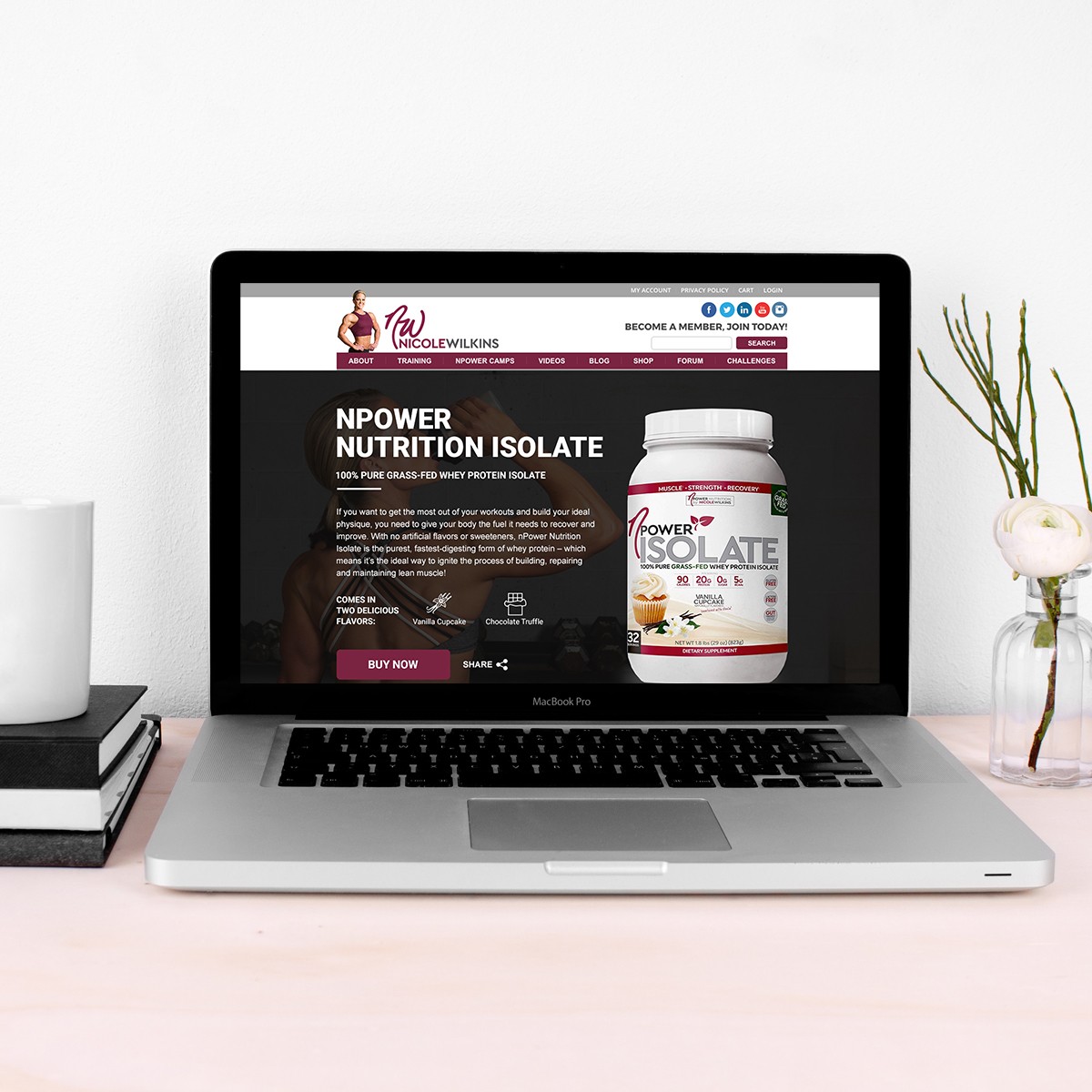 MacBook displaying Nicole Wilkins fitness website homepage showcasing NPower Nutrition Isolate supplement and website layout.