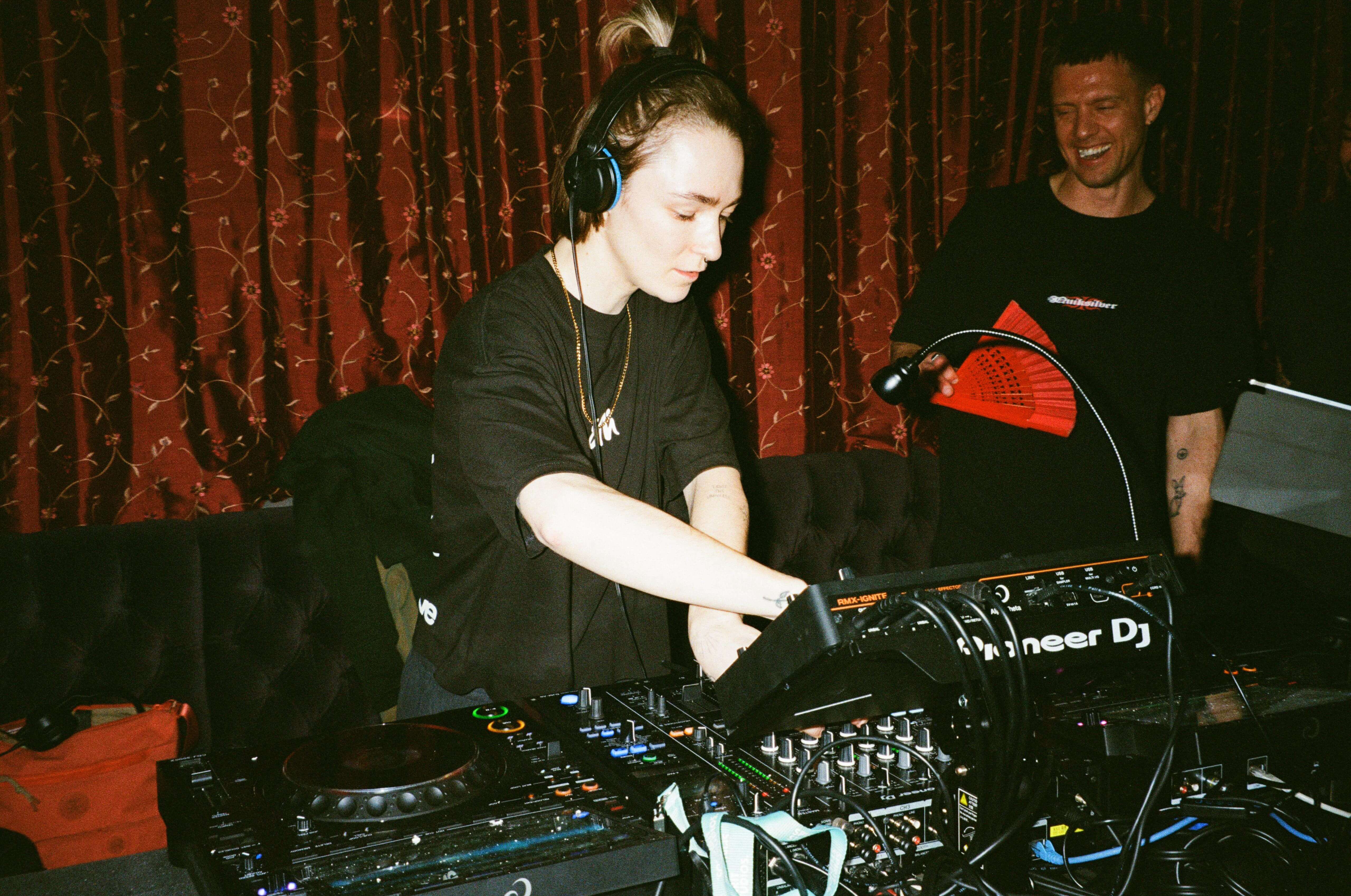 Young woman at a DJ booth
