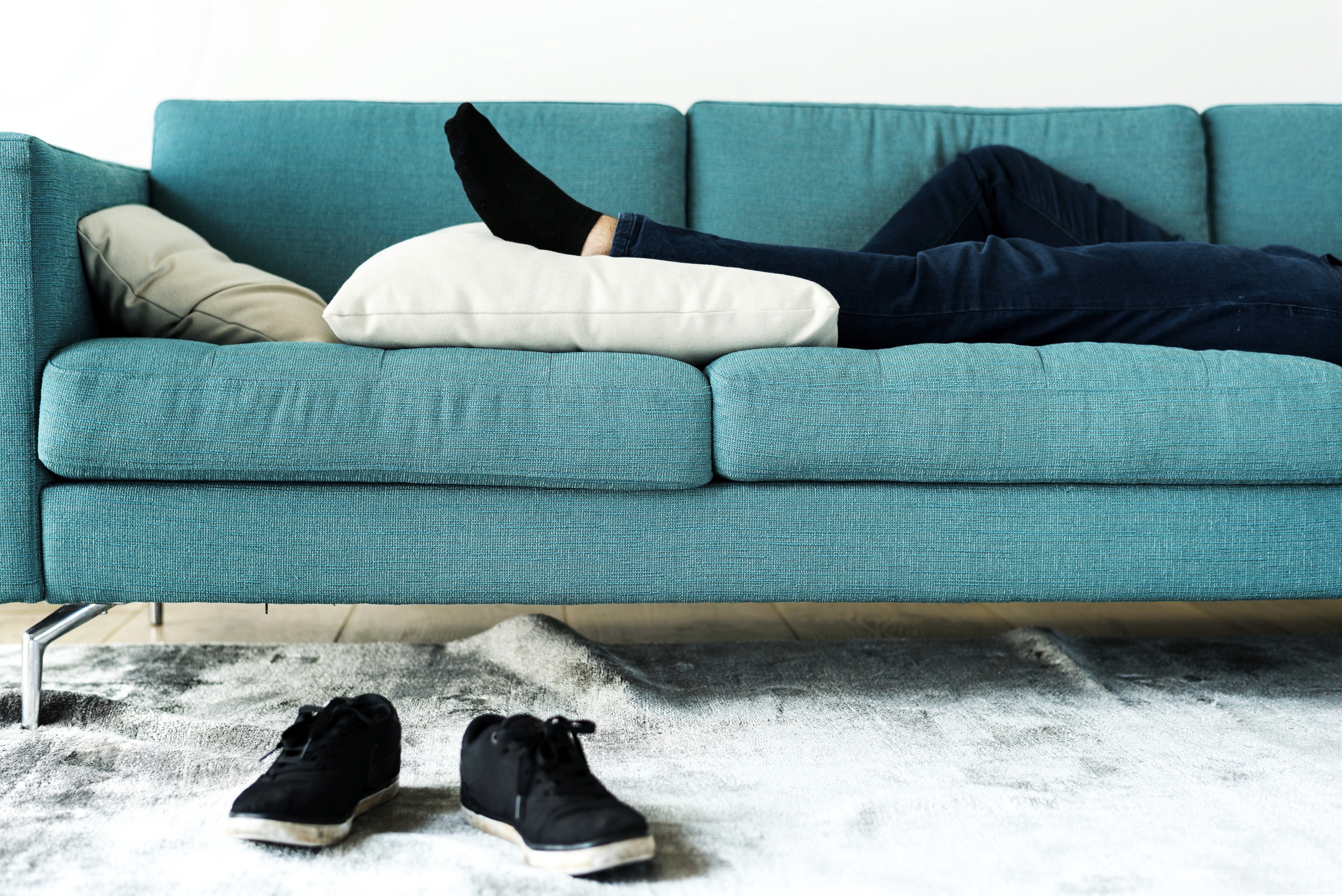 Person lying on sofa