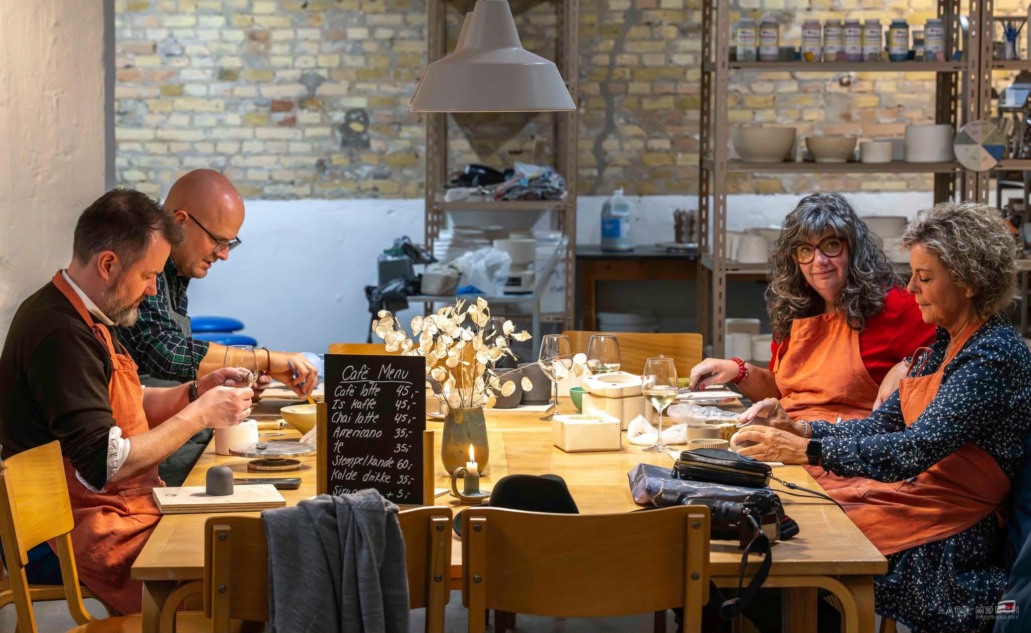 a group of friends enjoying a ceramic experience