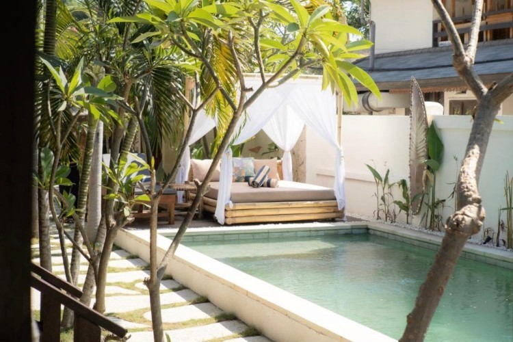 sunloungers fronting buildings near mountain