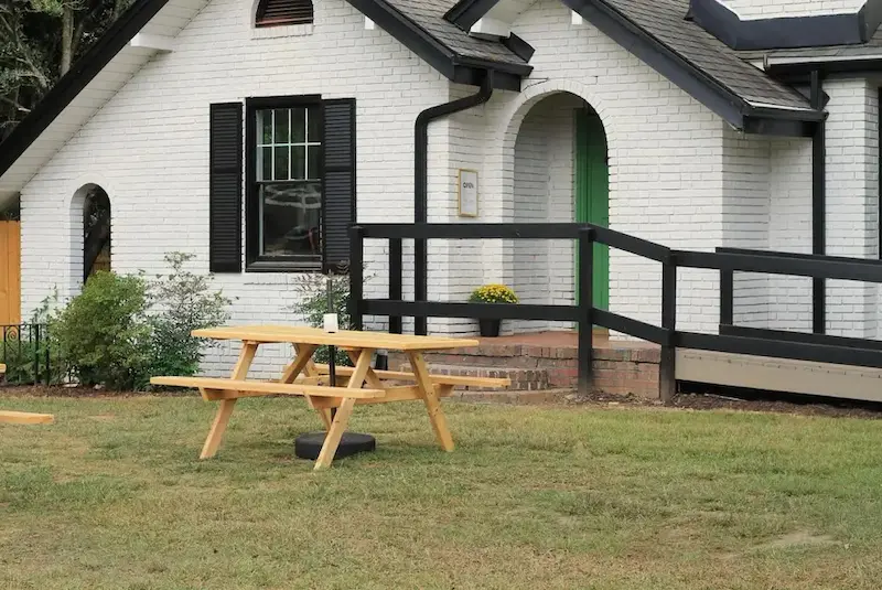 Professional lawn mowing service maintaining a residential yard in Greenville SC