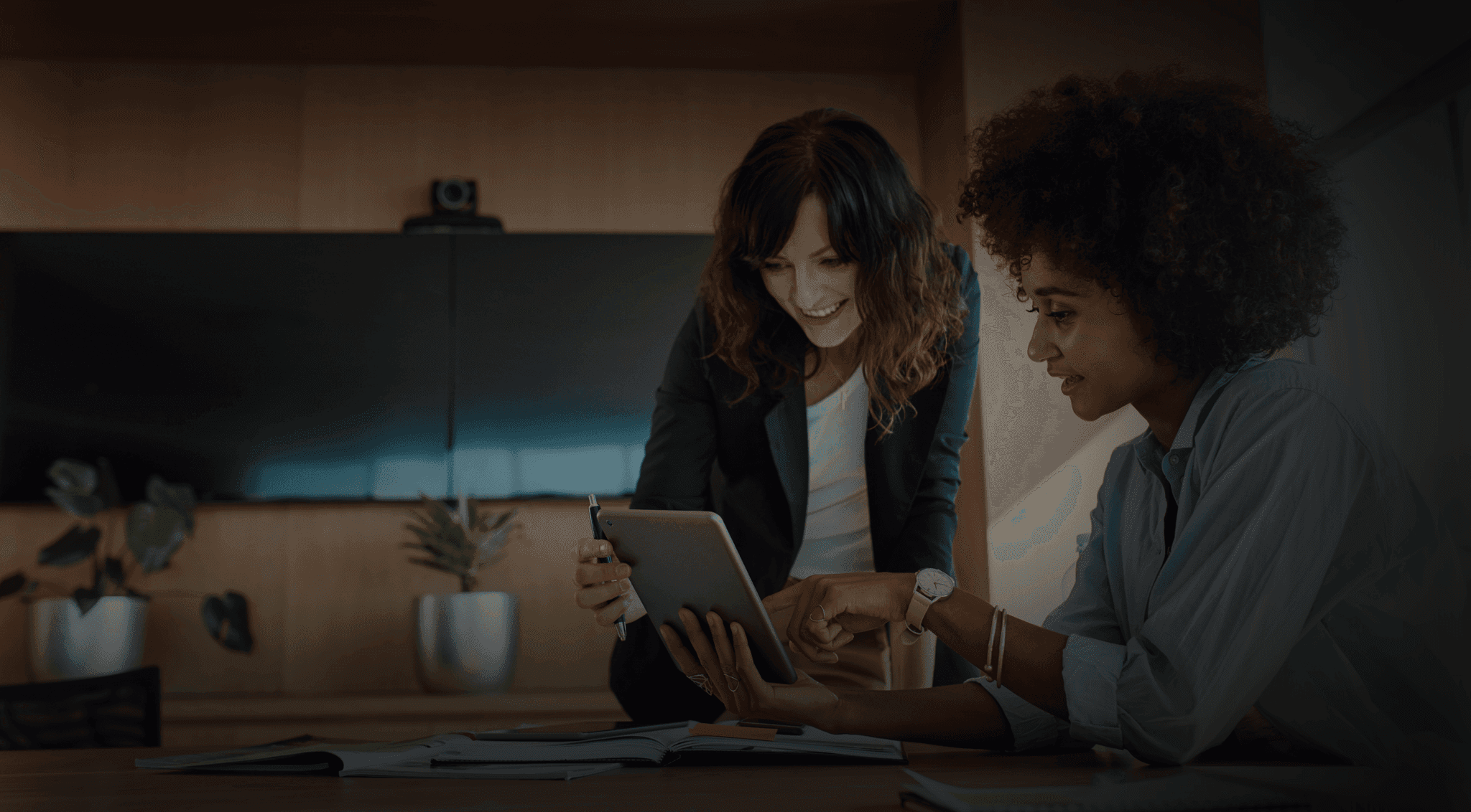 Two colleagues looking at an iPad together