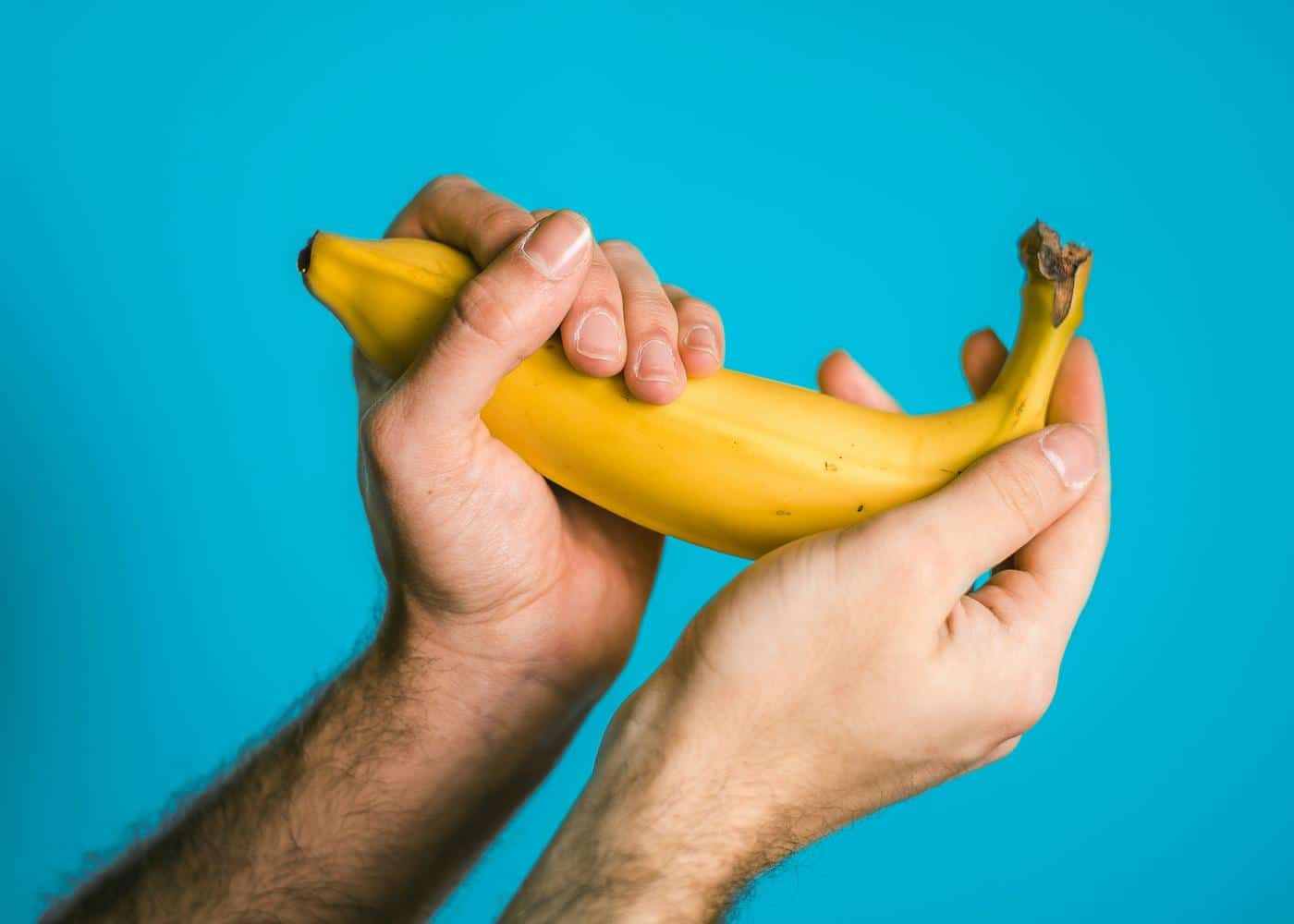 Man holding a banana in his hands
