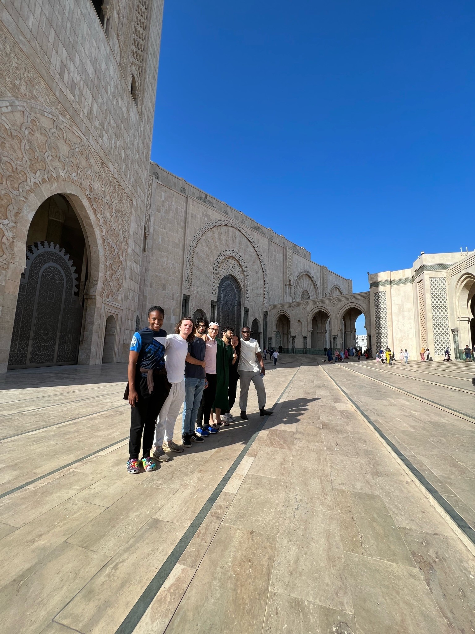 woman in black blazer smiling