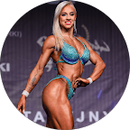 selective focus photo of man standing holding DSLR camera