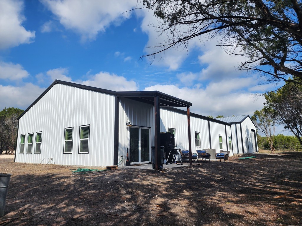 white metal building with red roof