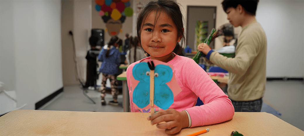 Children creating handmade crafts during structured after school arts and crafts program