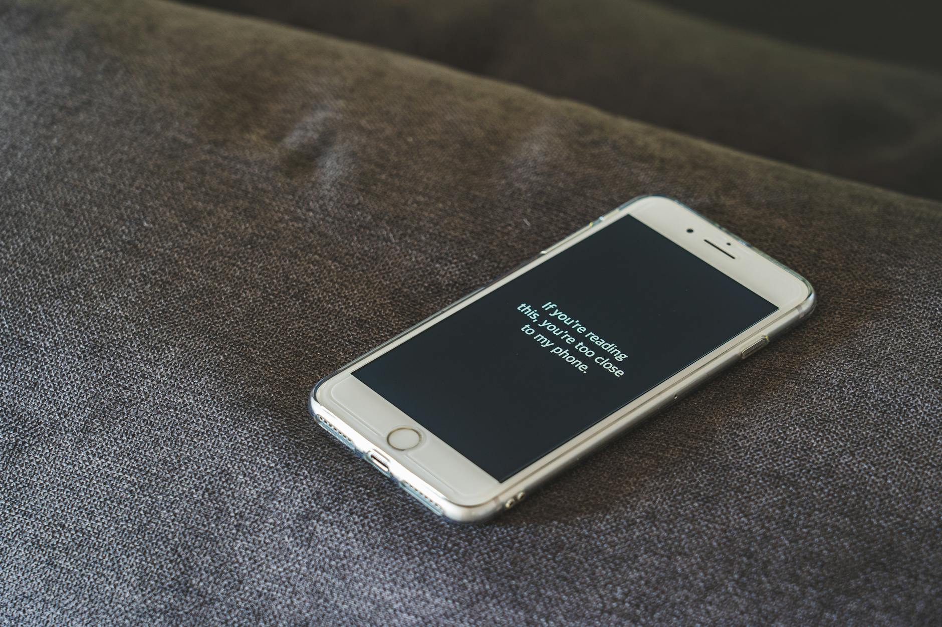 A wooden gavel resting on a digital tablet to represent the ethical considerations of artificial intelligence in education.