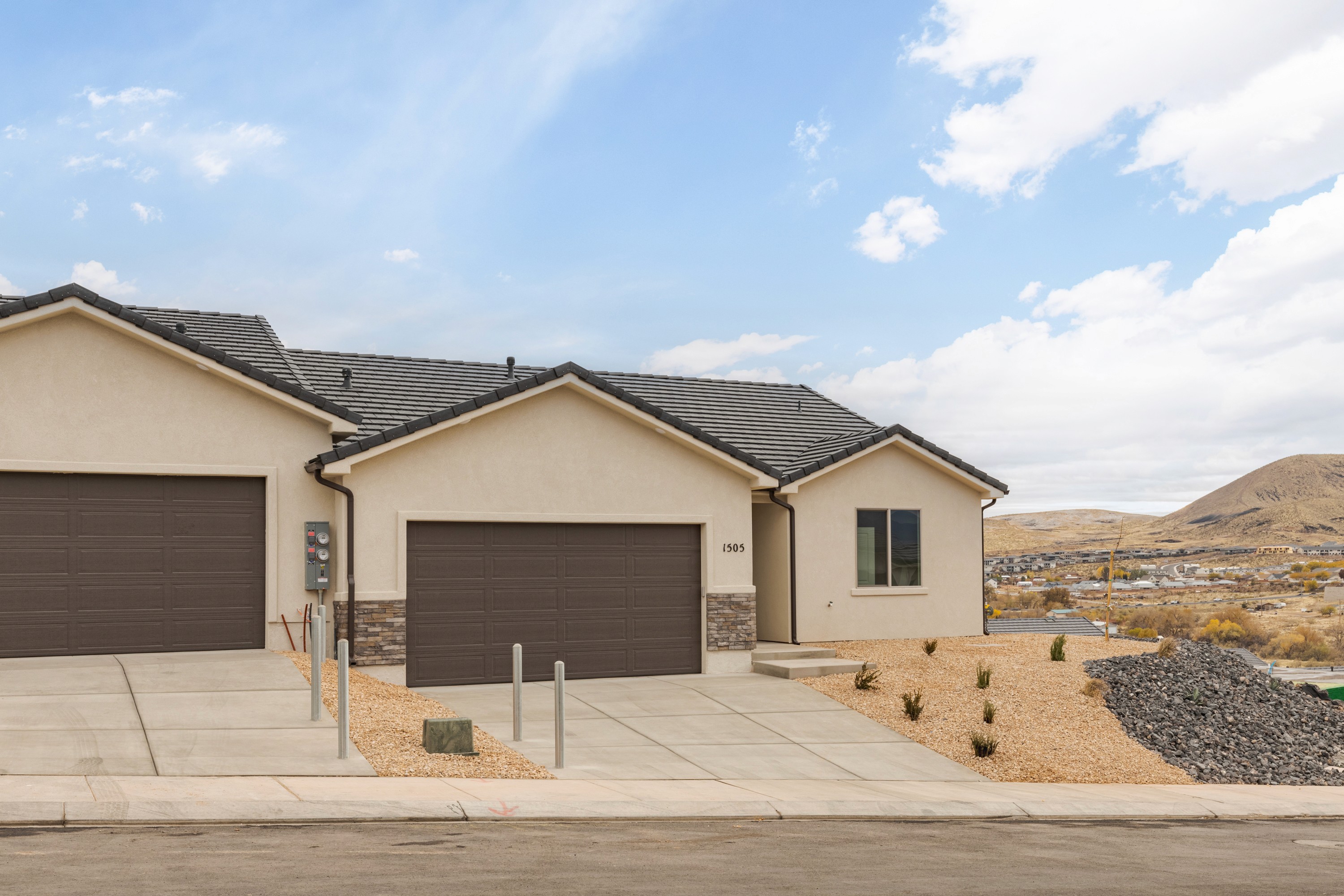 Front exterior perspective of the Painted Sands twin home in Hurricane, Utah showing the elevation.