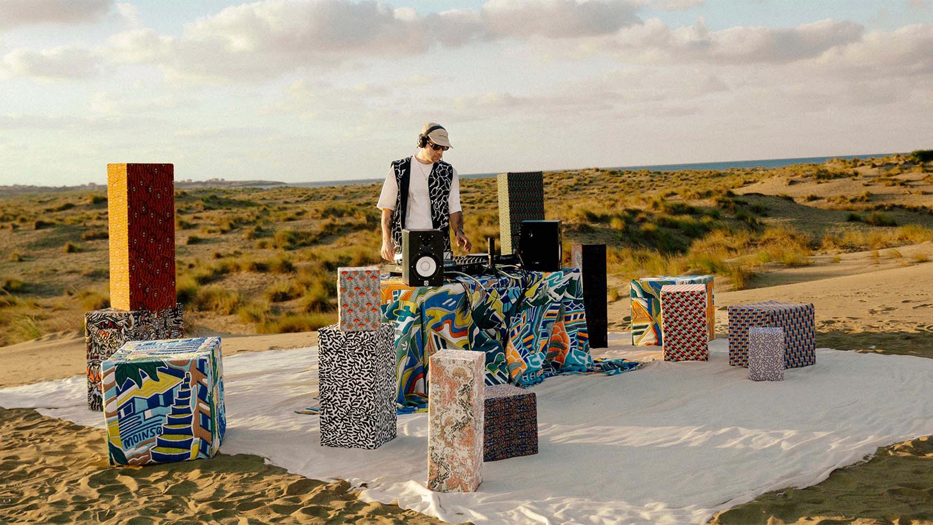 Streetside billboard with flyposters of the Batch.Works brand and illustrations