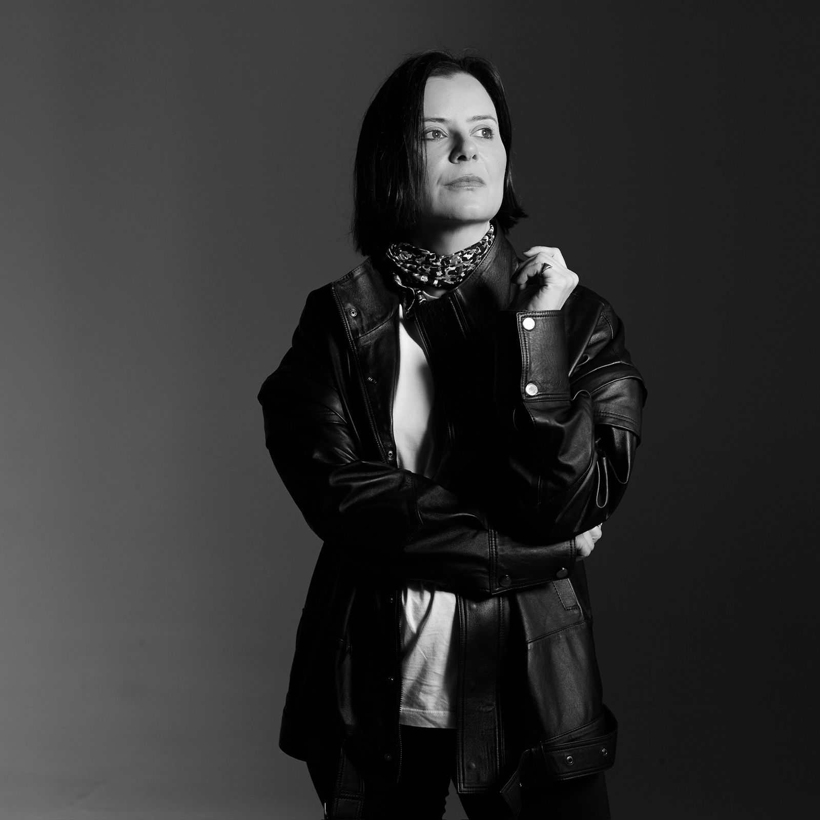 grayscale photo of woman wearing necklace and top