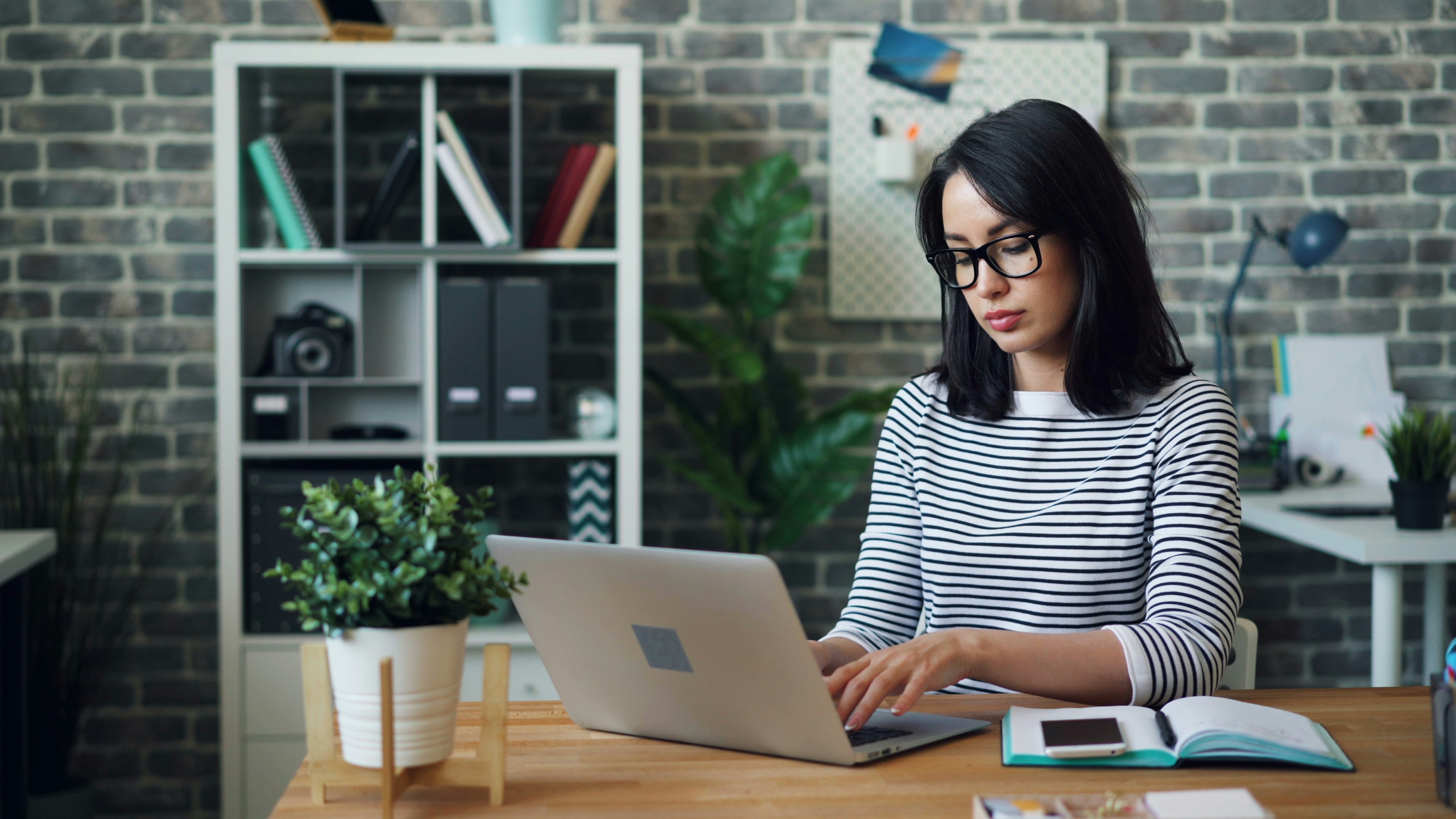 woman in an office learning How To Delete Large Emails In Gmail